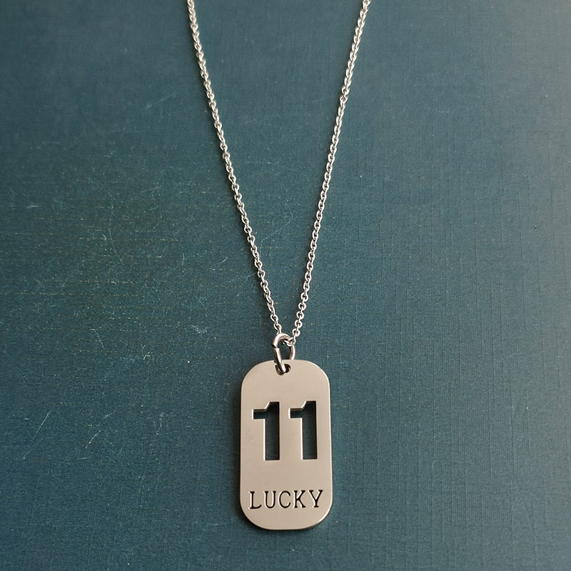 Cross-border foreign trade hollowed-out lucky number eleven keychain, brushed military brand titanium steel stainless steel necklace pendant detail image 10