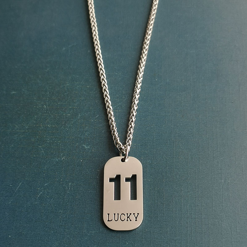 Cross-border foreign trade hollowed-out lucky number eleven keychain, brushed military brand titanium steel stainless steel necklace pendant Application Scenario