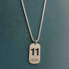 Cross-border foreign trade hollowed-out lucky number eleven keychain, brushed military brand titanium steel stainless steel necklace pendant Item Picture