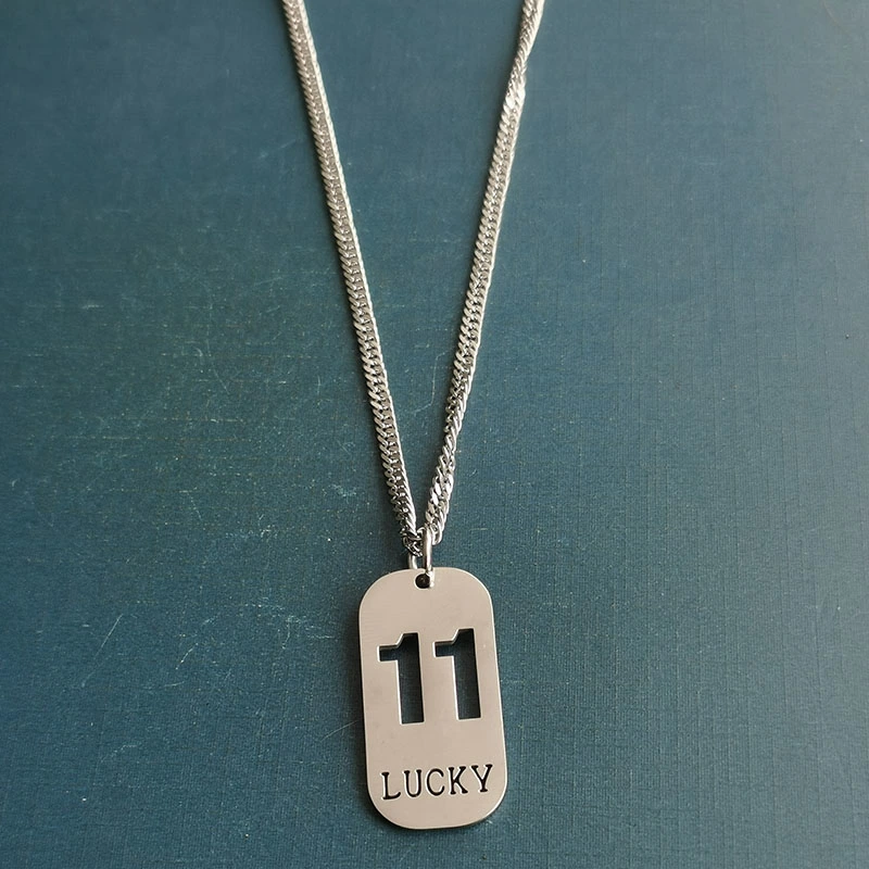 Cross-border foreign trade hollowed-out lucky number eleven keychain, brushed military brand titanium steel stainless steel necklace pendant detail image 8