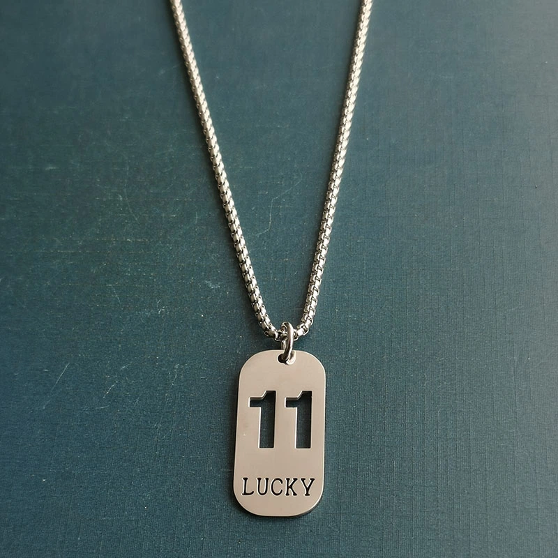 Cross-border foreign trade hollowed-out lucky number eleven keychain, brushed military brand titanium steel stainless steel necklace pendant detail image 6