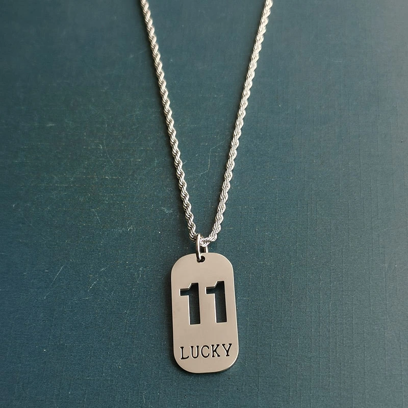 Cross-border foreign trade hollowed-out lucky number eleven keychain, brushed military brand titanium steel stainless steel necklace pendant detail image 3