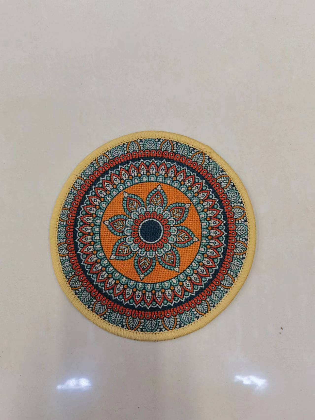 The new round ins linen printed placenta, fine linen printed absorbent anti-slip mat, coaster, mouse pad and bowl pad come in multiple patterns and styles. They feature a Bohemian style with a rubber base and clear printing. The size is 20*20cm details Picture