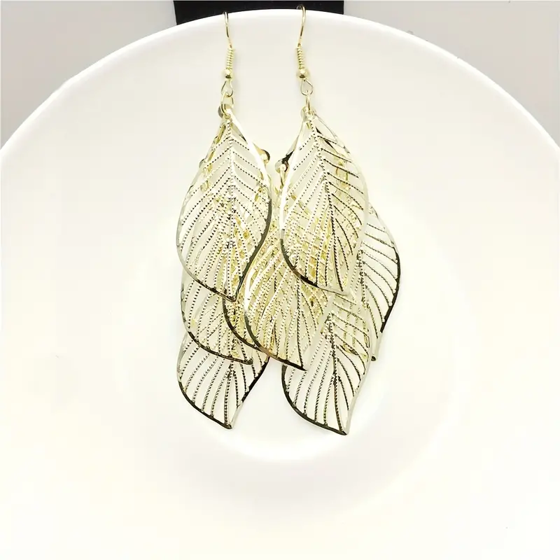 E2402 National Style Retro Women's Earrings Simple Hollow Multi-Layer Leaves European And American Popular Tassel Earrings Cross-Border Application Scenario
