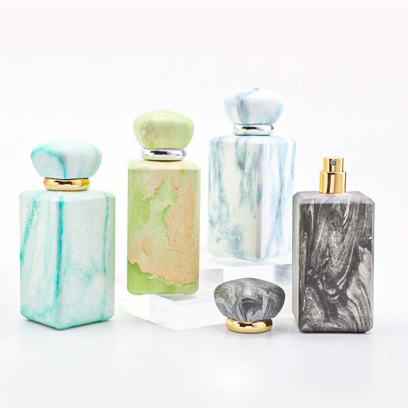 The manufacturer custom-made 100ml perfume bottle with a thickened press-type nozzle. It features a niche design and a thickened bottom in four colors details Picture