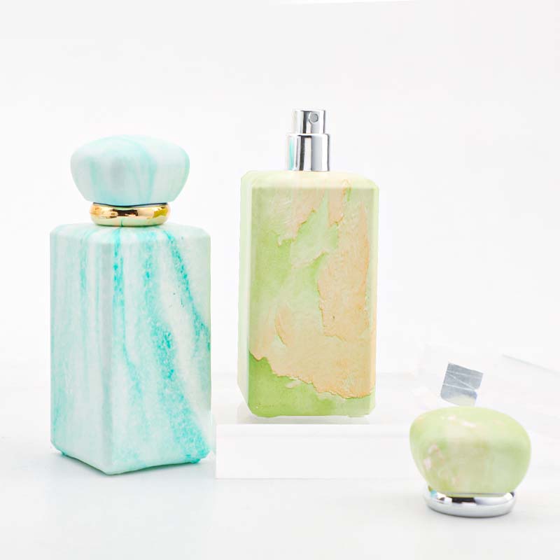 The manufacturer custom-made 100ml perfume bottle with a thickened press-type nozzle. It features a niche design and a thickened bottom in four colors Application Scenario