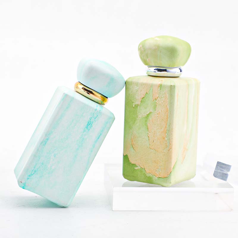 The manufacturer custom-made 100ml perfume bottle with a thickened press-type nozzle. It features a niche design and a thickened bottom in four colors Specification image