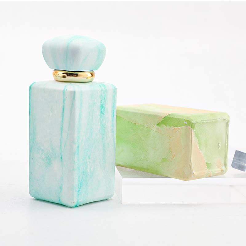 The manufacturer custom-made 100ml perfume bottle with a thickened press-type nozzle. It features a niche design and a thickened bottom in four colors Item Picture