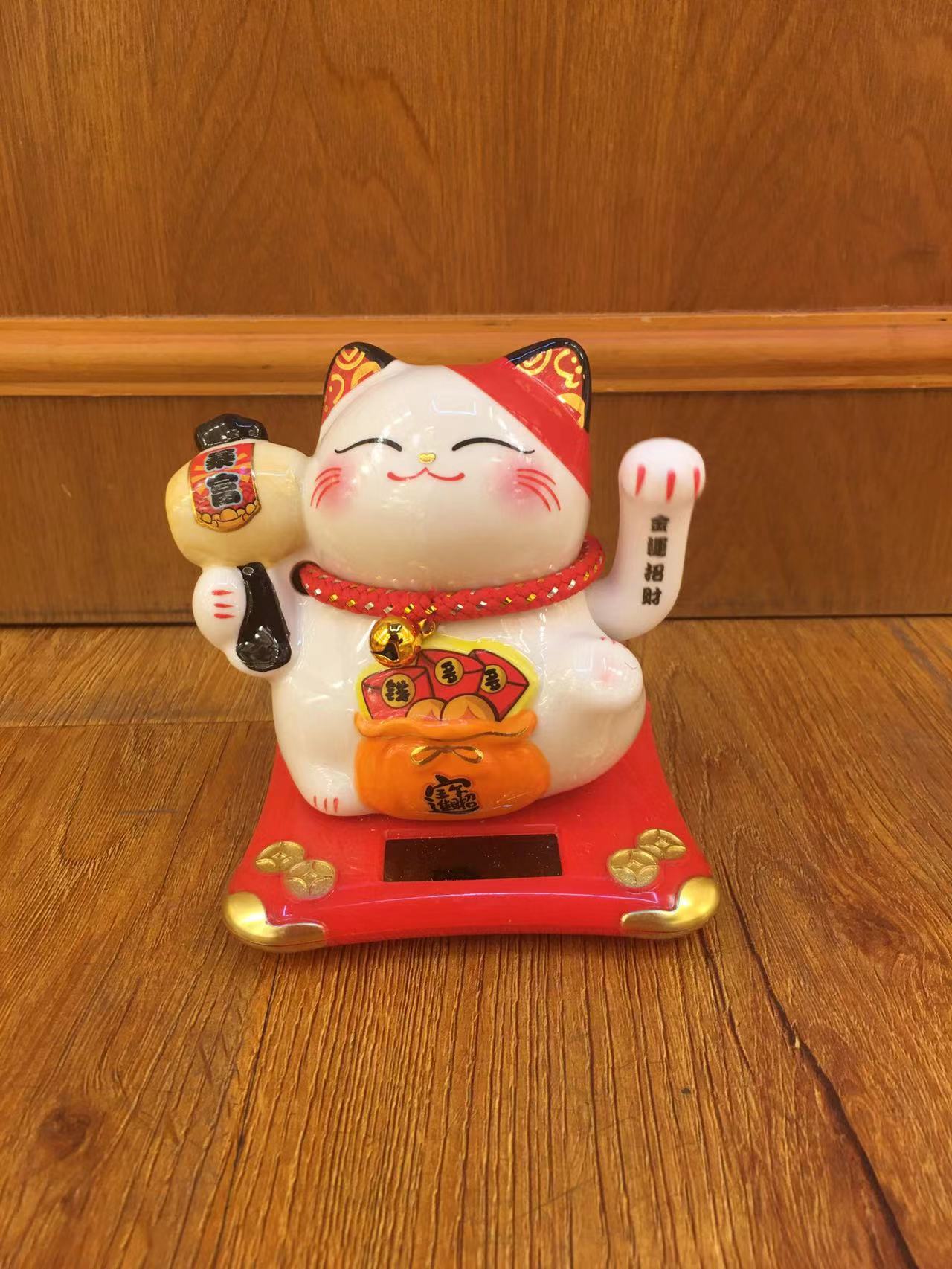 聚宝袋开运财源滚滚光感摇手猫车载家内摆件招财猫工艺品