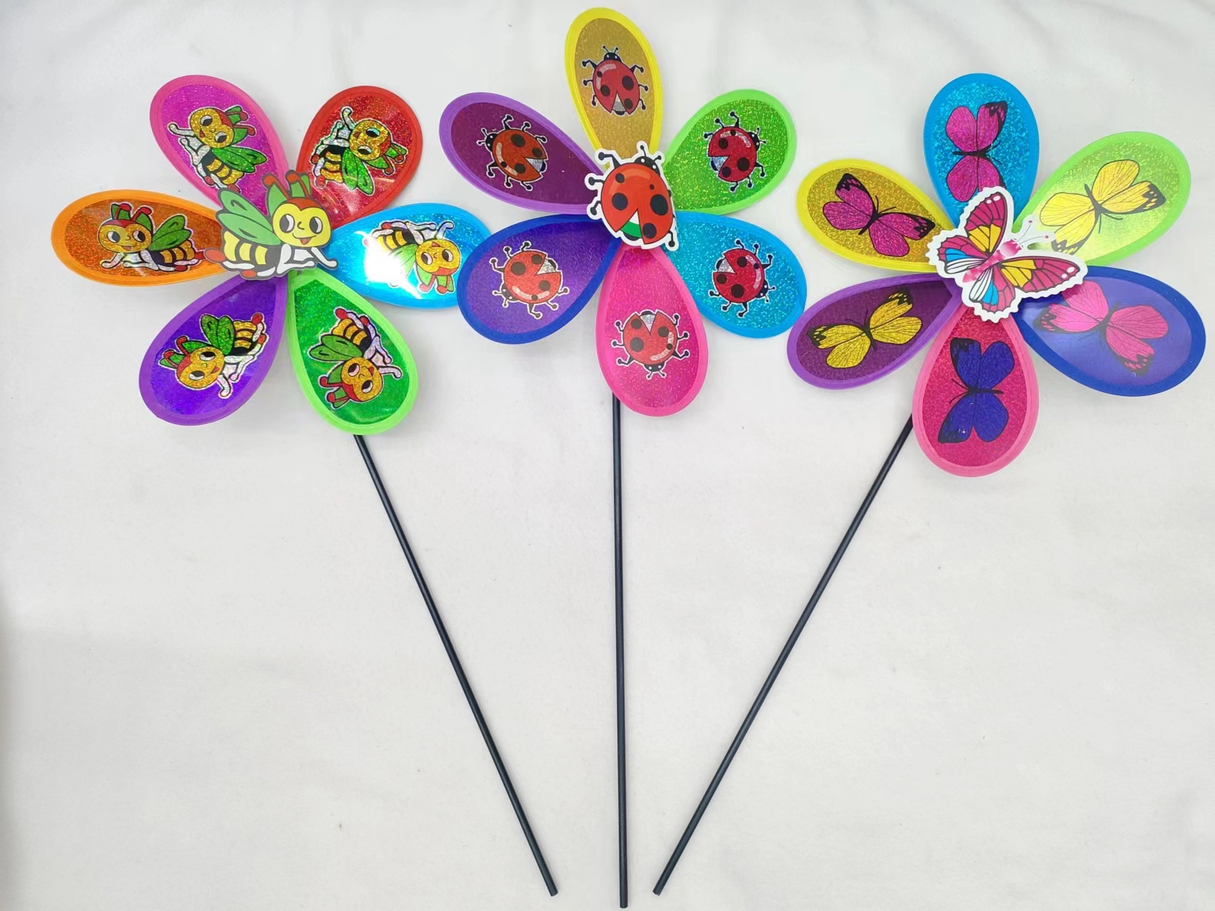 Small flashing animals, beetles, bees, butterflies and windmills