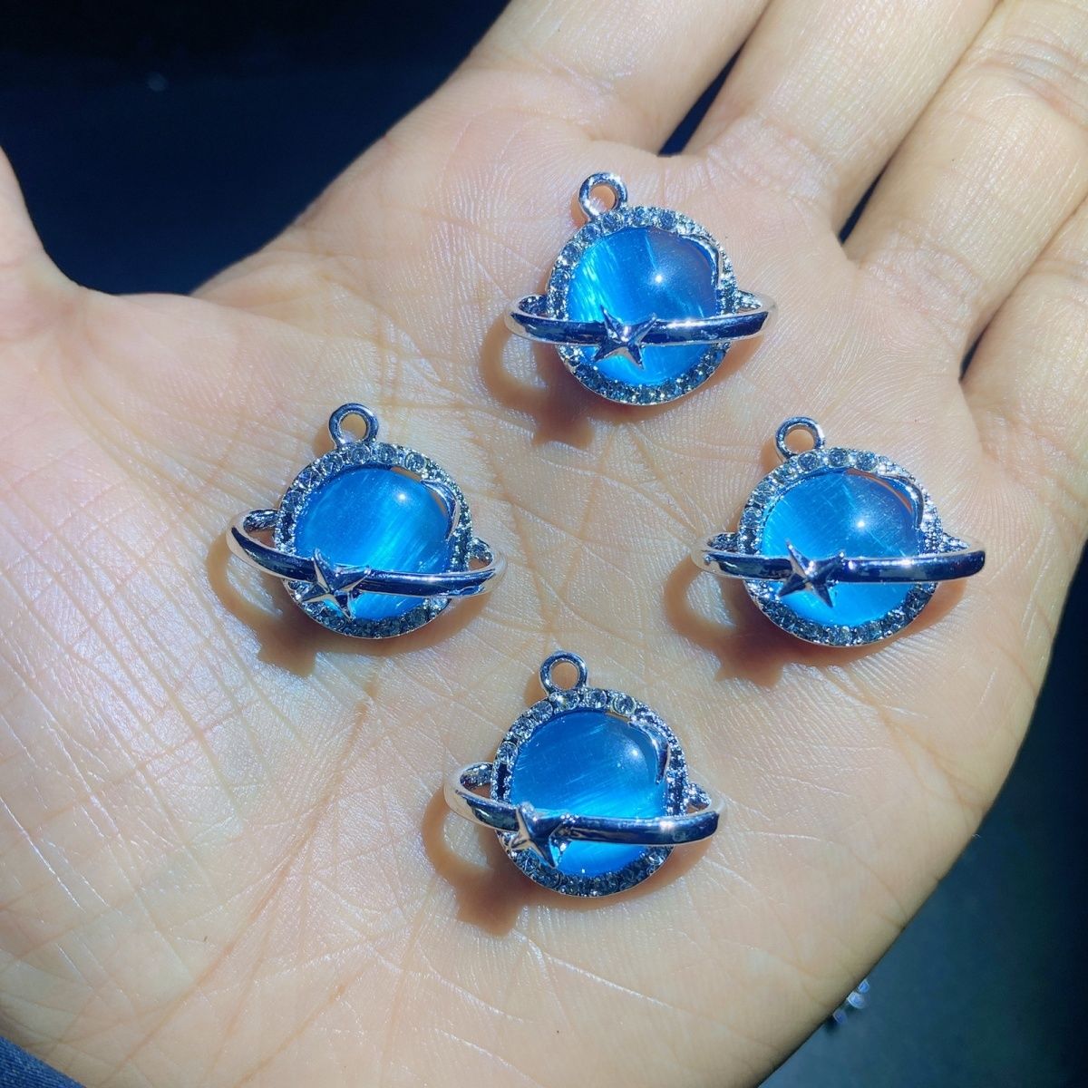 Wholesale of light luxury cat's eye stone planet bracelets, earrings, necklaces, accessories, diy handcrafted materials, pendants, ornaments and pendants in Yiwu