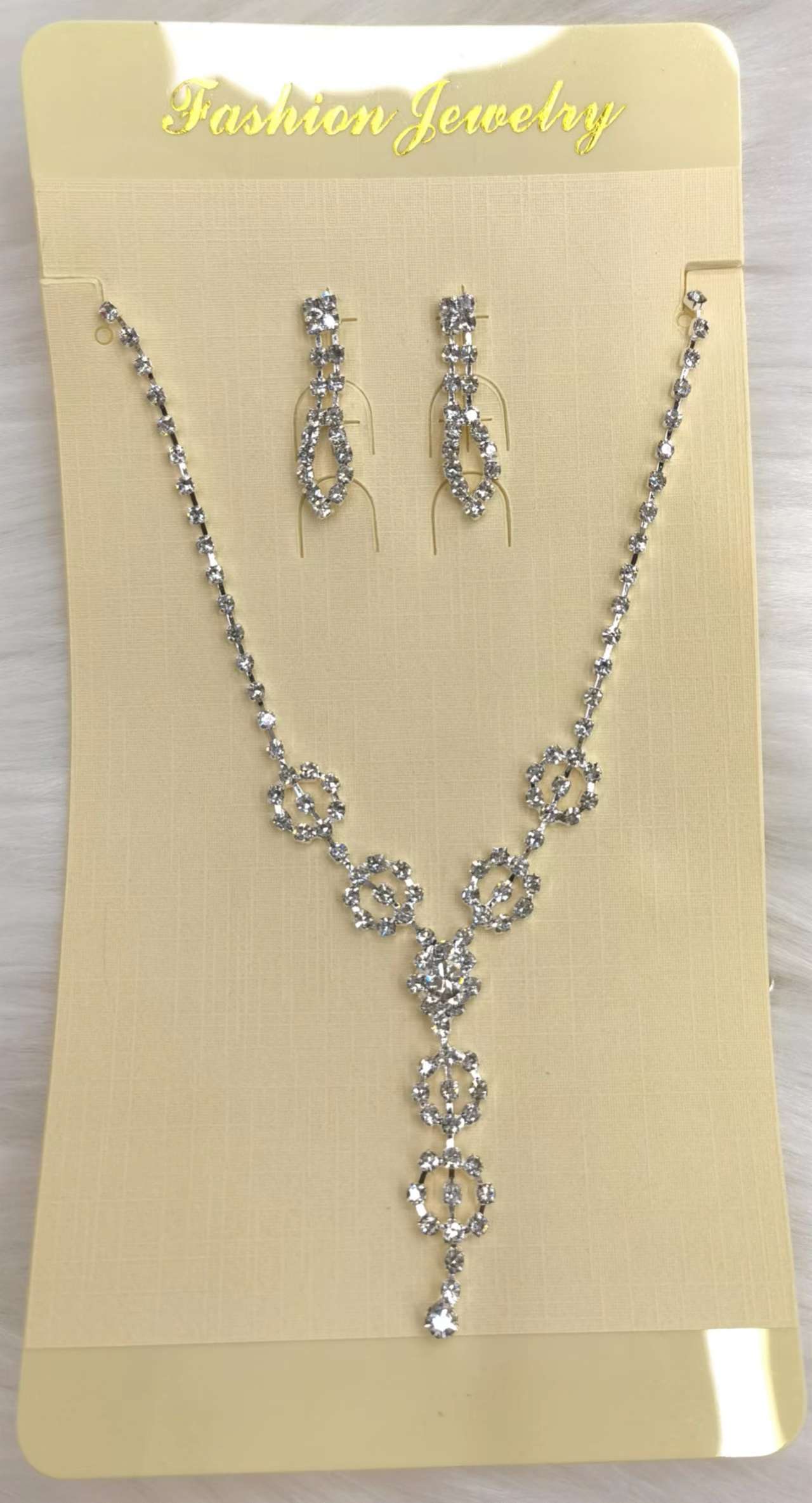 A set of two exquisite small diamond necklace earrings