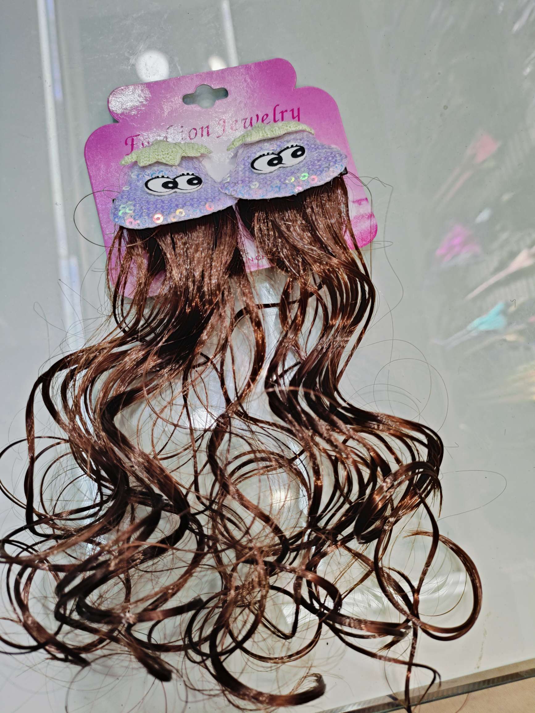 A girl is wearing a bow, a princess hairpin, a hair accessory and a headpiece