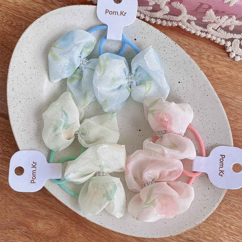 New Korean-style sweet bow hair tie, floral pearl fabric hair tie, high-elasticity and versatile hair tie Application Scenario
