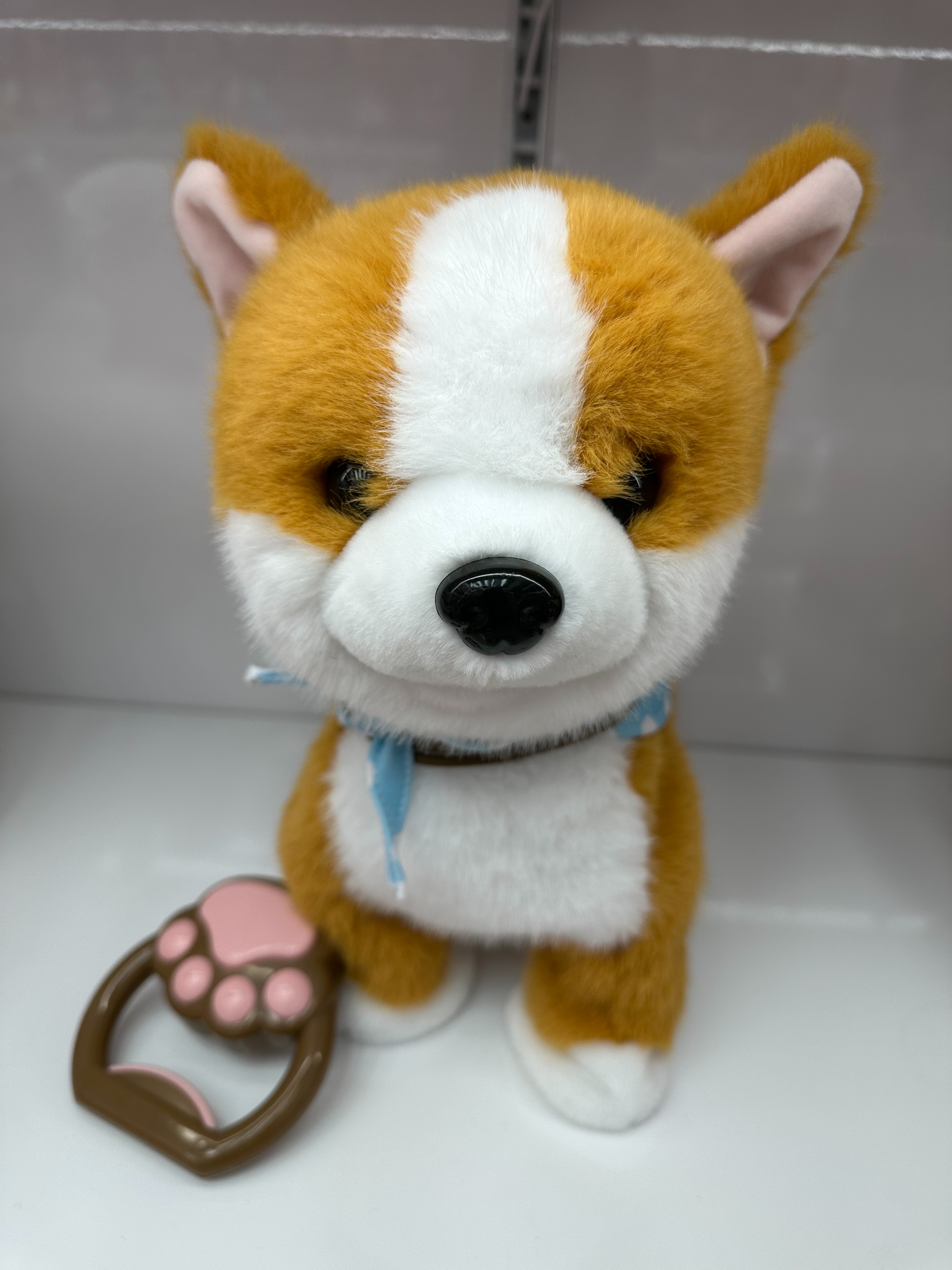 Toy de cuerda lamiendo la lengua juguete juguete de simulación de cachorro cantando