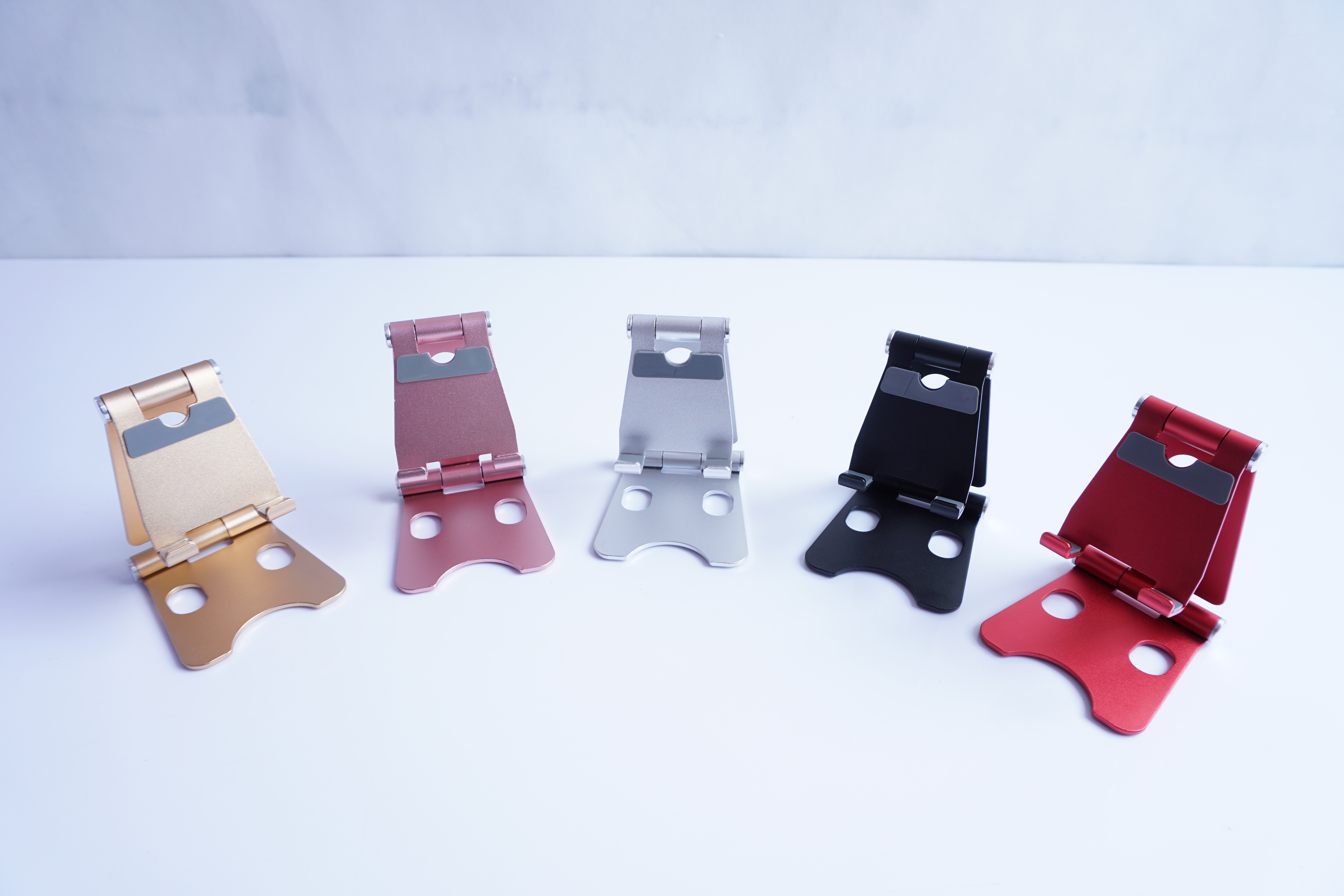 Double folding phone stand, small size, dual rotating shafts adjustable, small size can be folded and stored Item Picture