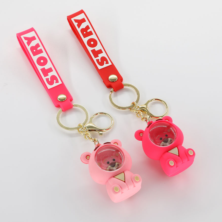 Wholesale of popular cartoon strawberry bear keychains, space bear figurines, schoolbag decorations, astronaut best friend and couple gifts details Picture