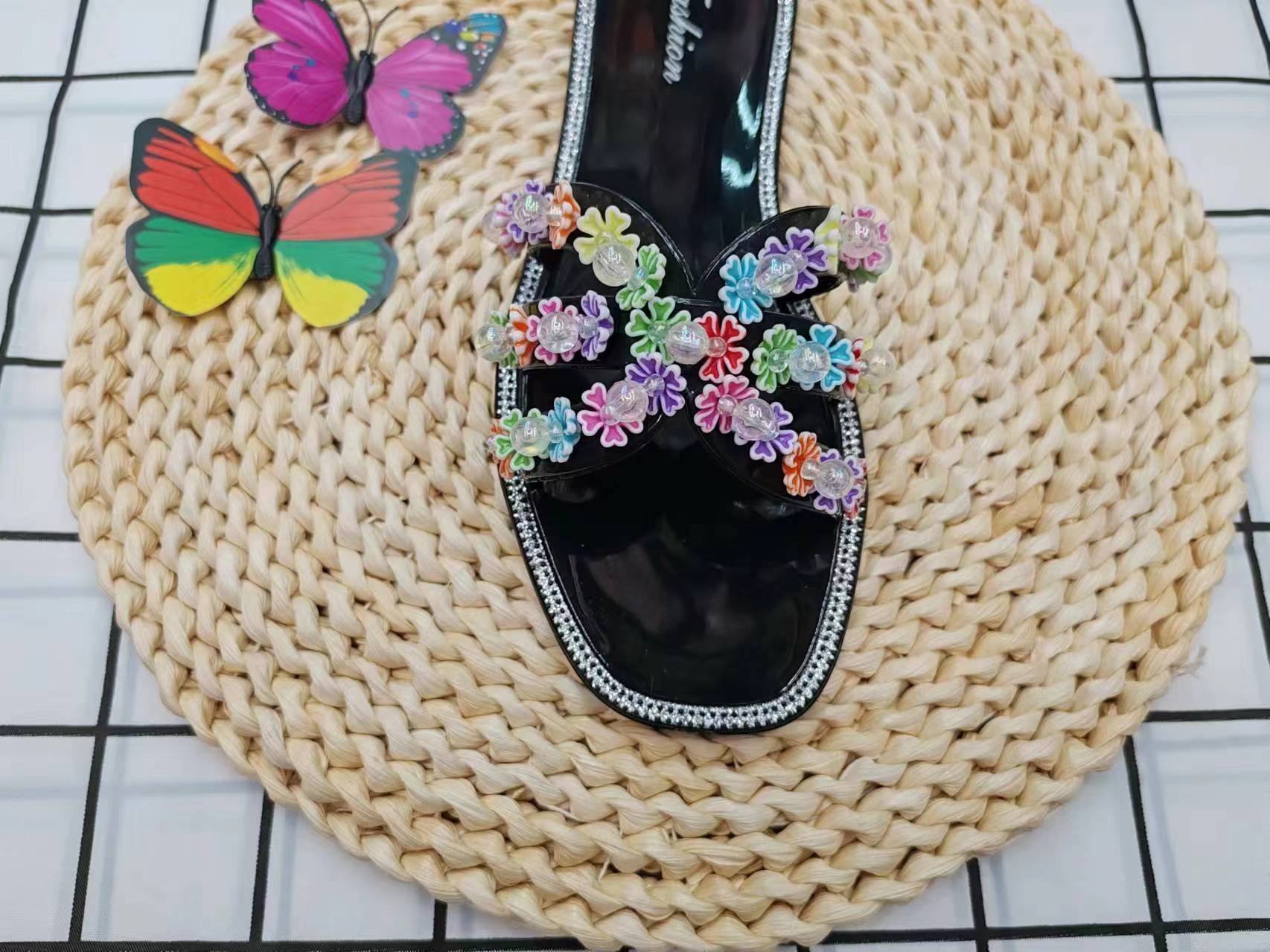Summer fashion: Wearing cool flip-flops with colorful flowers outside details Picture
