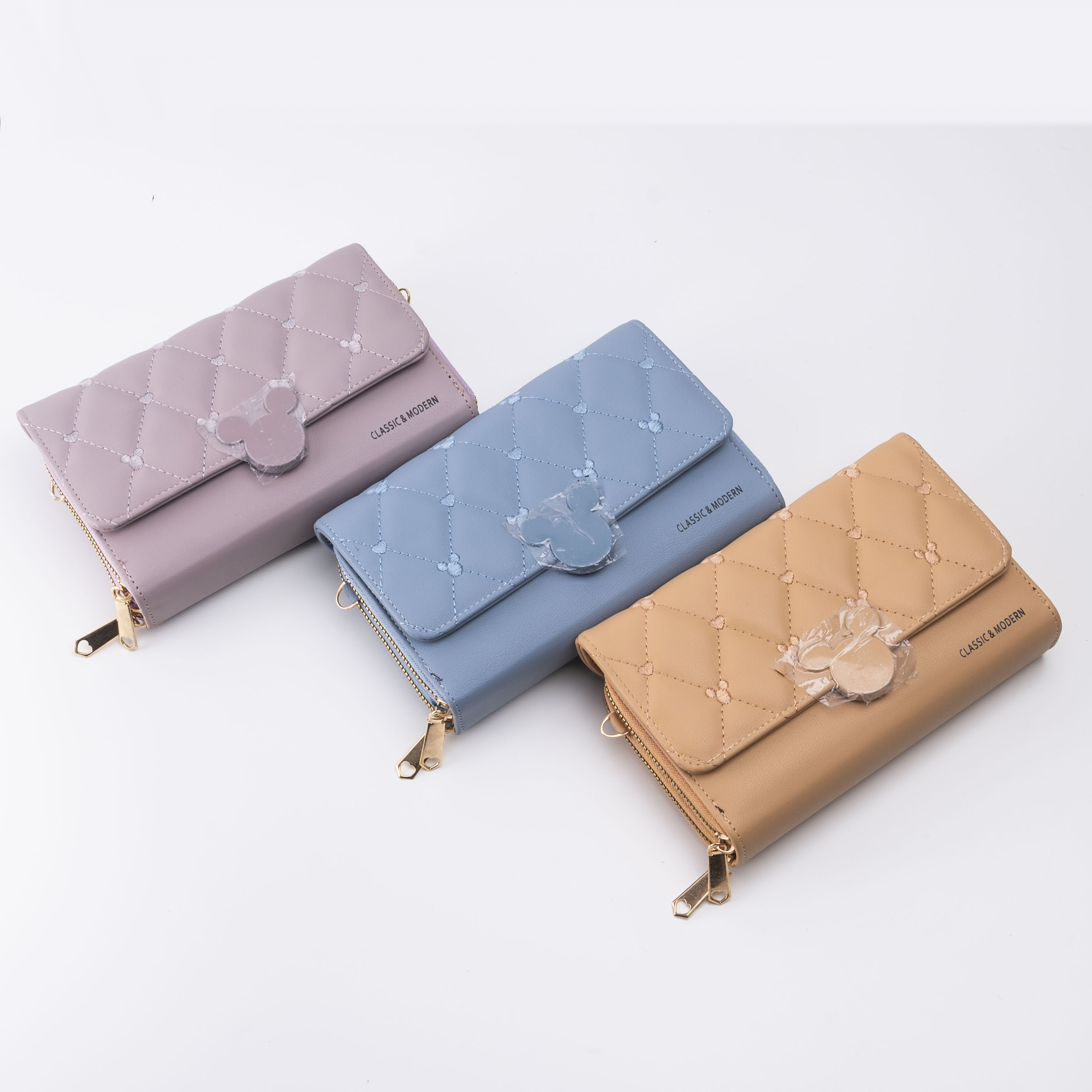 新款女士钱包长款时尚流苏多卡位拉链扣子手拿包工厂直供