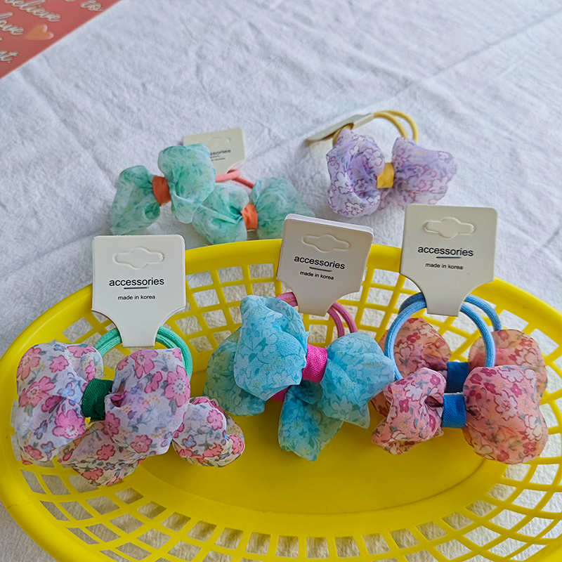 The new Korean-style pastoral floral bow hair tie is versatile for children, fresh and cute, and won't damage hair. It can be used as a hair tie Item Picture