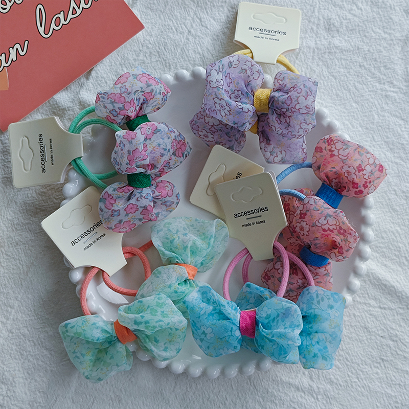 The new Korean-style pastoral floral bow hair tie is versatile for children, fresh and cute, and won't damage hair. It can be used as a hair tie Application Scenario