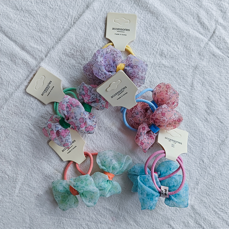 The new Korean-style pastoral floral bow hair tie is versatile for children, fresh and cute, and won't damage hair. It can be used as a hair tie