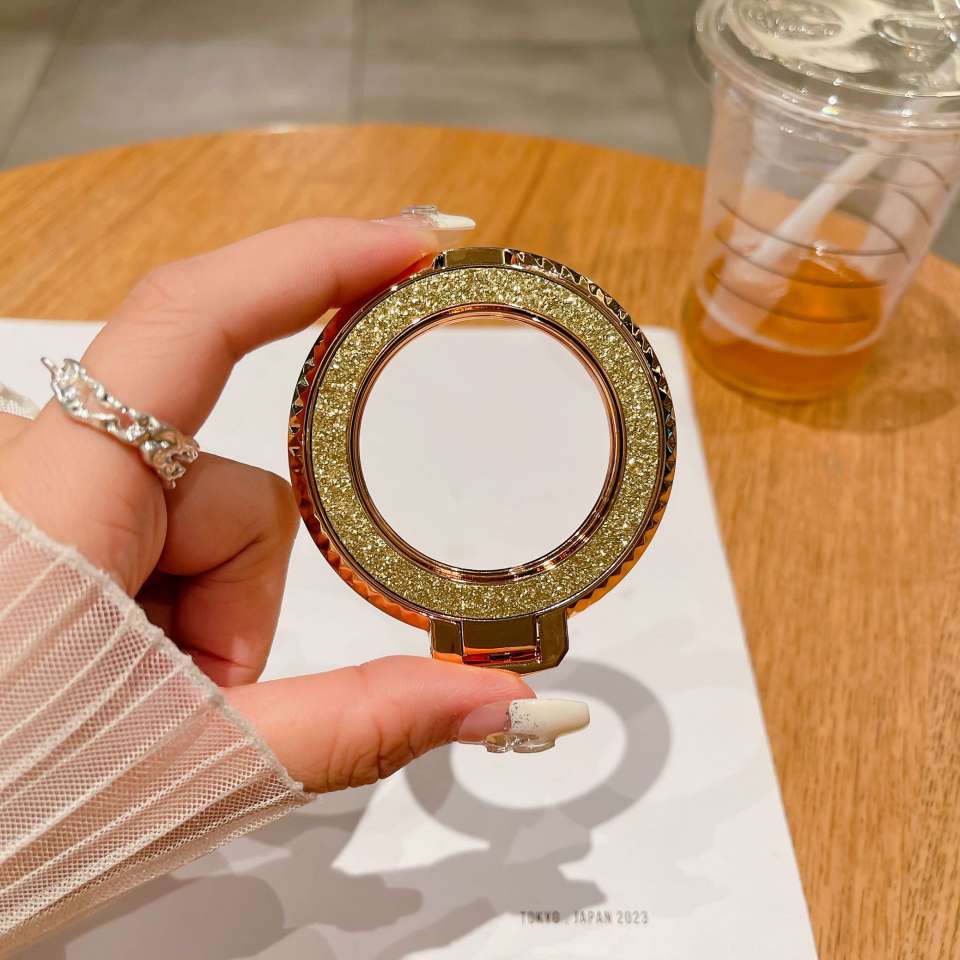 New back sticker diamond-patterned magnetic glitter hollowed-out phone stand, desktop lazy person creative folding wireless charging ring