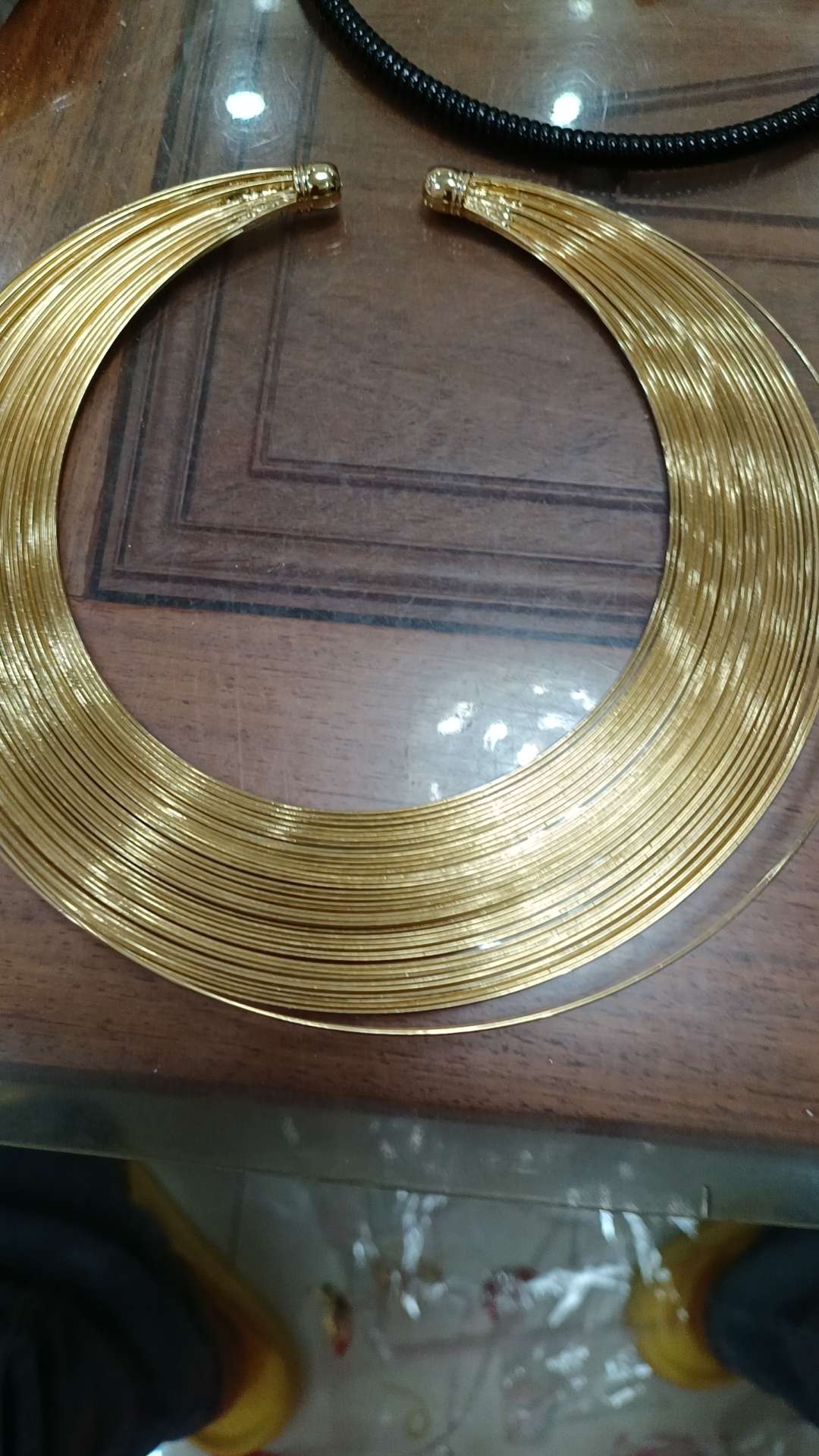 An exaggerated golden iron wire collar
