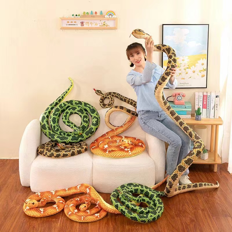 A big python plush toy doll, a funny and mischievous long golden python pillow, a cartoon animal toy that plays tricks on people