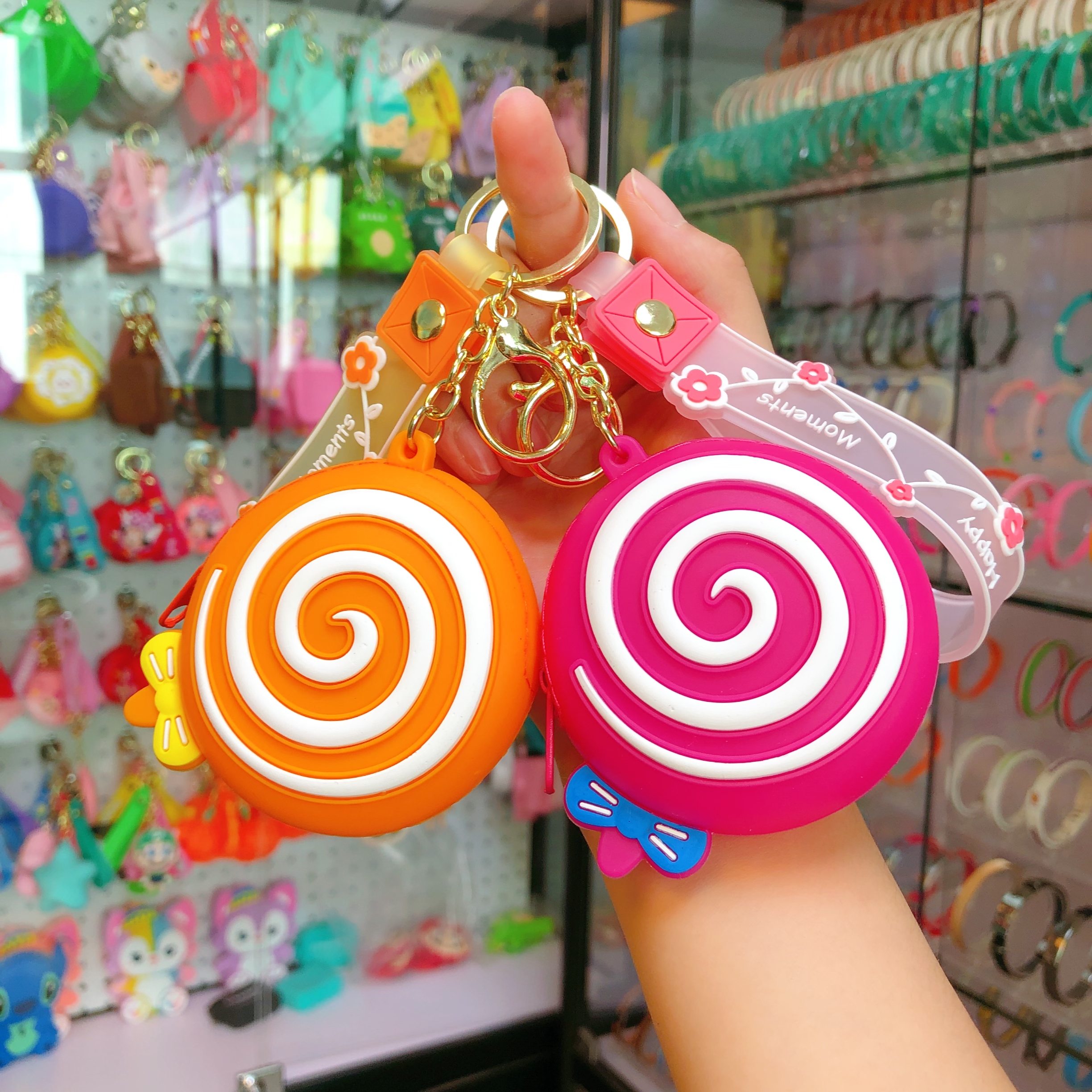 Creative and cute soft rubber lollipop coin purses, keychains, women's earphone storage bags, car pendants, keychains wholesale creative and cute soft rubber lollipop coin purses, keychains, women's earphone storage bags, car pendants, keychains wholesale details Picture