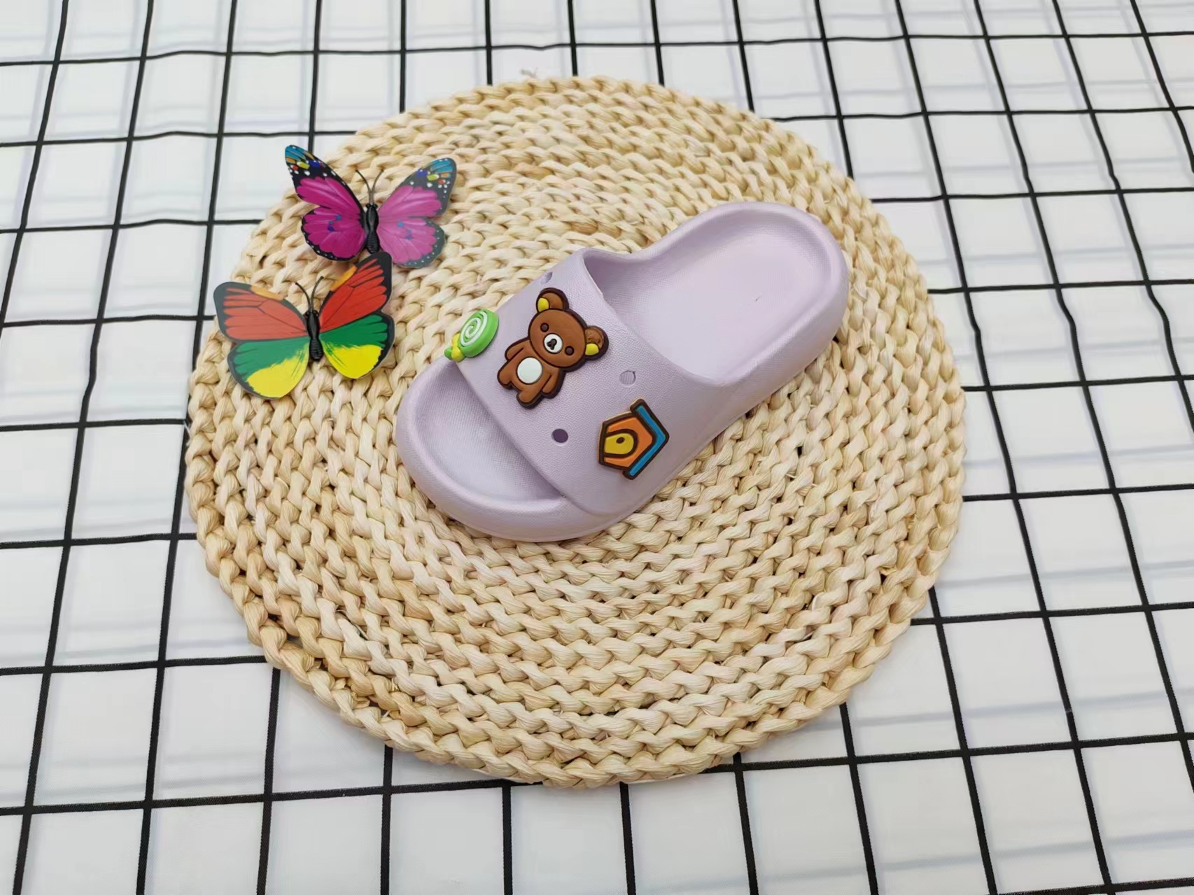 The cute cartoon little bear wears flip-flops outside in summer Specification image