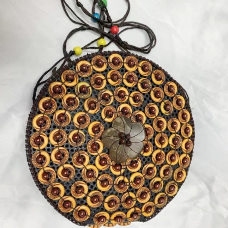 Large round coconut shell handcrafted beaded women's buns with ethnic style characteristics, hollowed-out coconut shell diagonal cross buns in stock details Picture