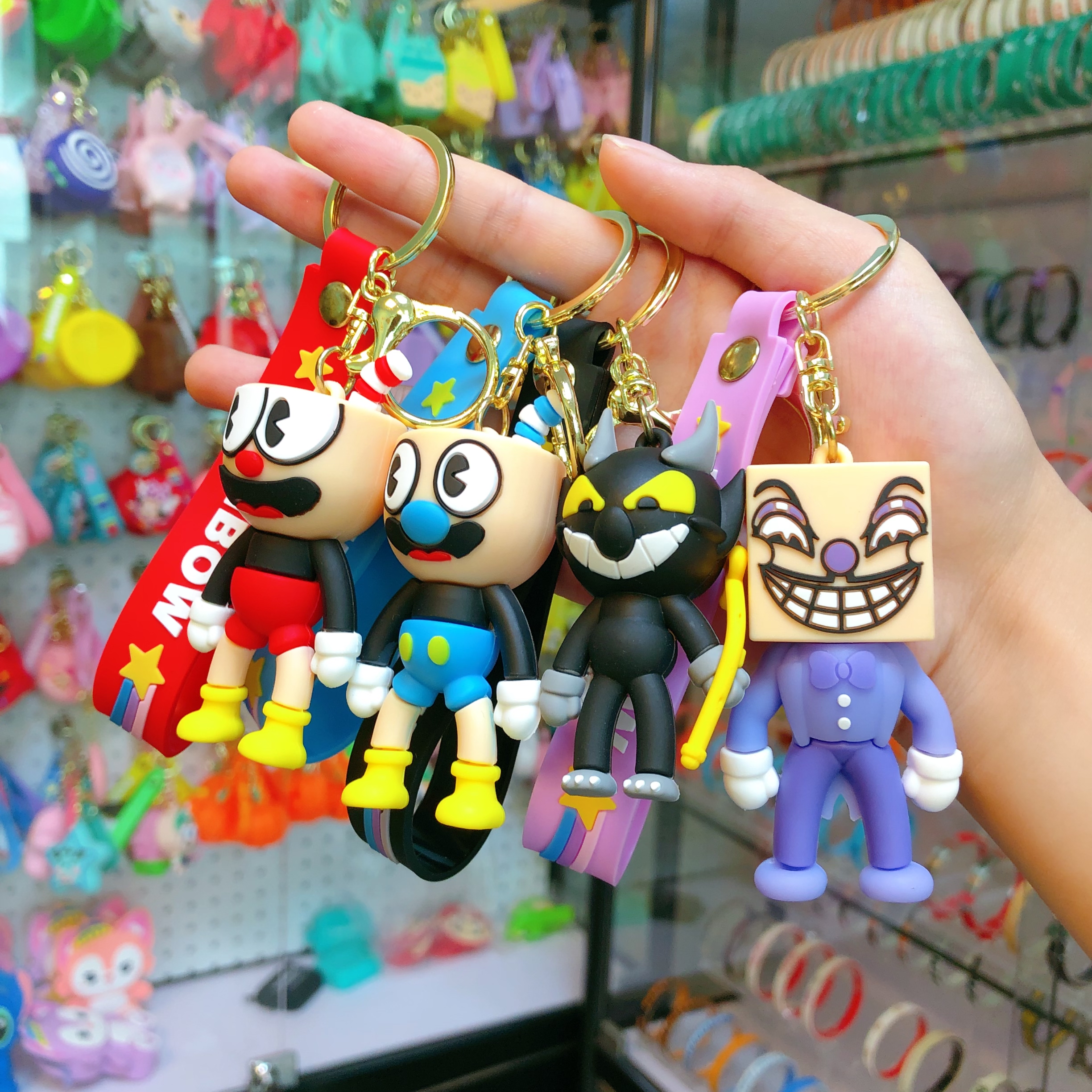 Wholesale of soda water figure keychain figurines, popular key chain accessories, pendants, creative and cute car schoolbags