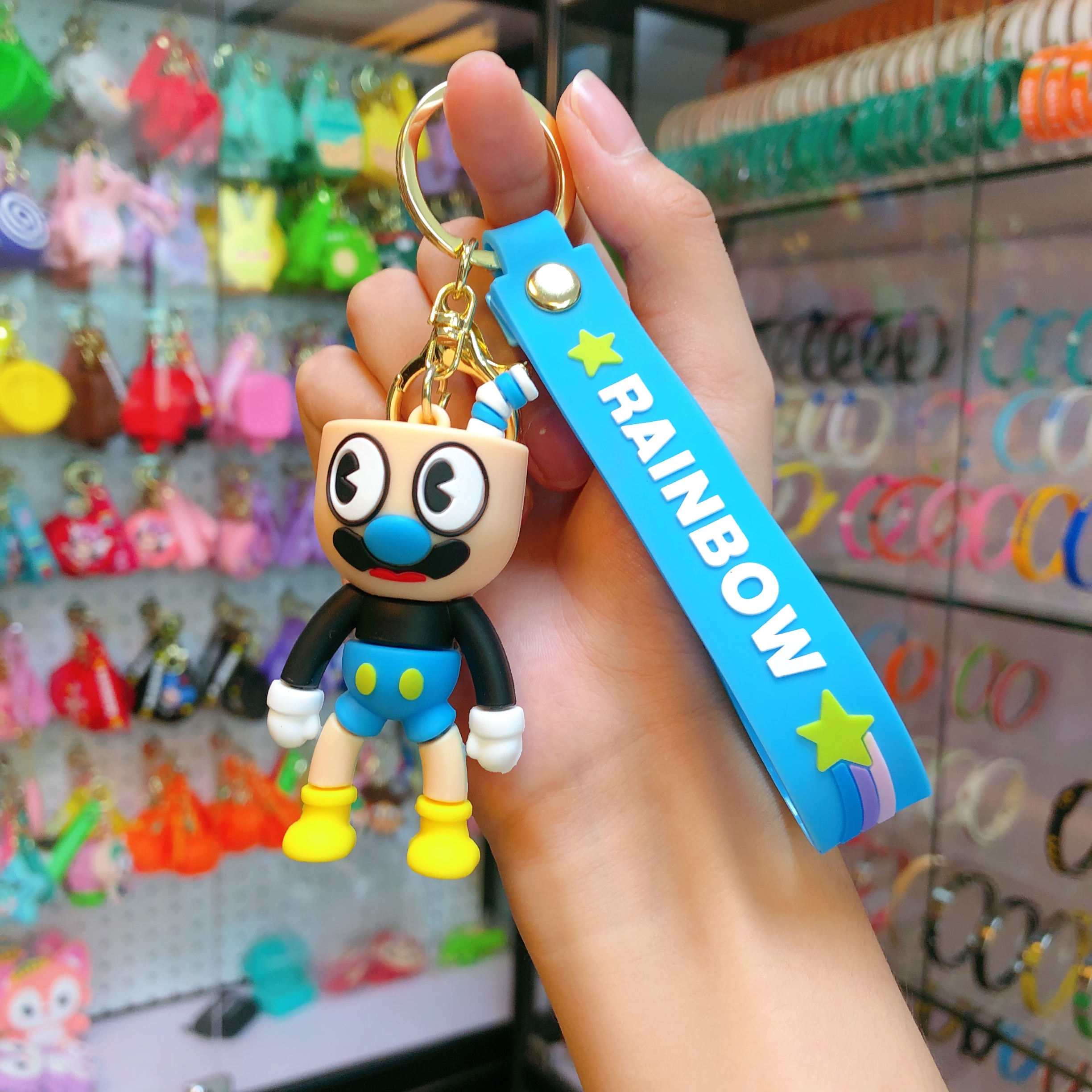 Wholesale of soda water figure keychain figurines, popular key chain accessories, pendants, creative and cute car schoolbags Application Scenario