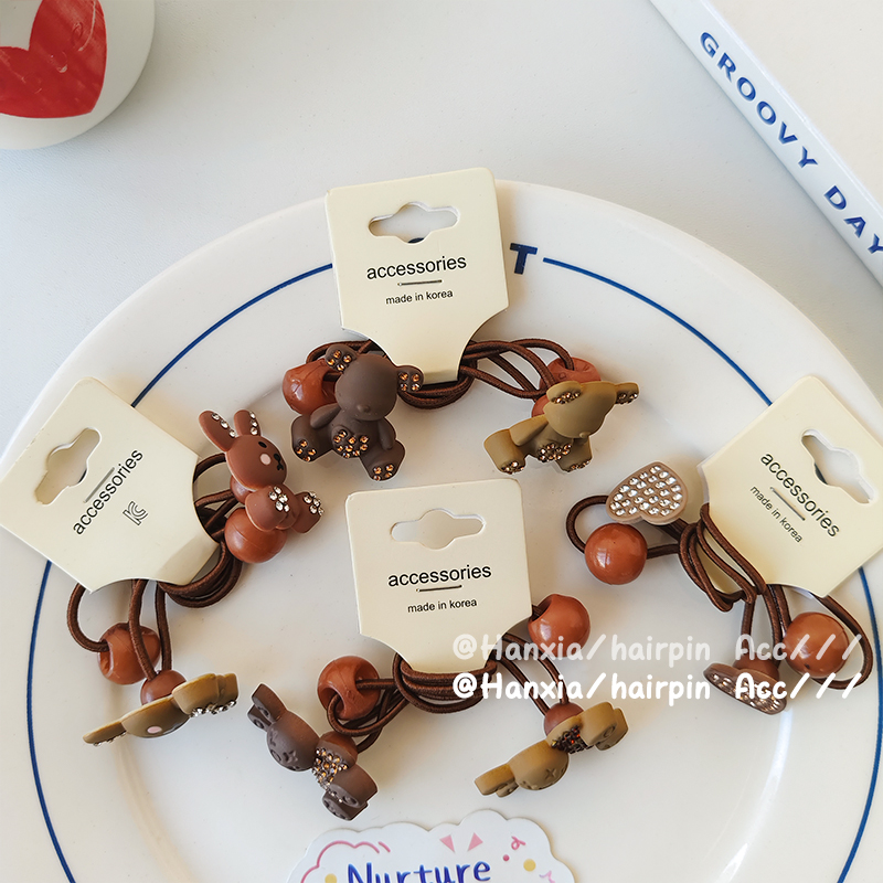 New Korean version autumn and winter children's rubber band, heart bear decorative hair tie, baby hair band, high elasticity and simple hair tie Application Scenario