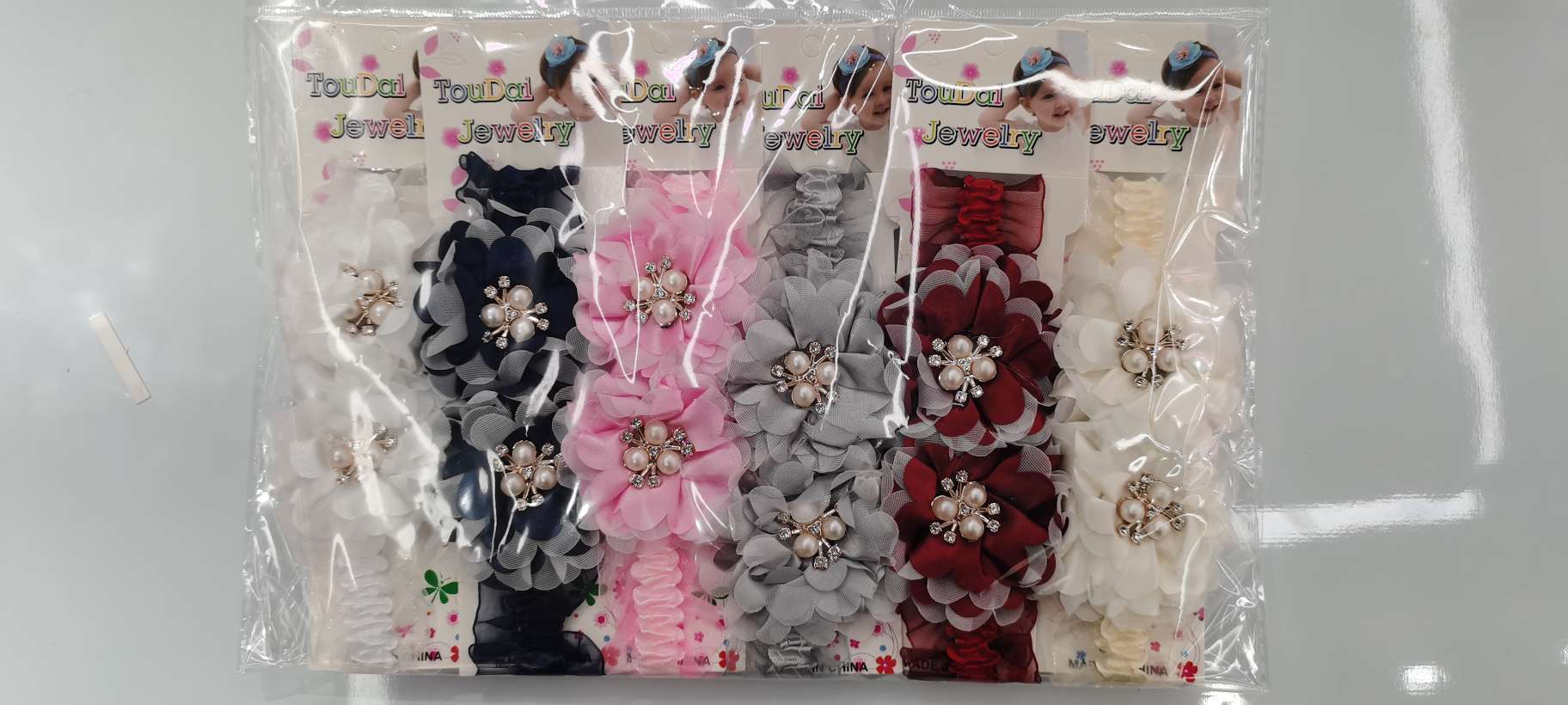 小沙带双花树叶三角珠