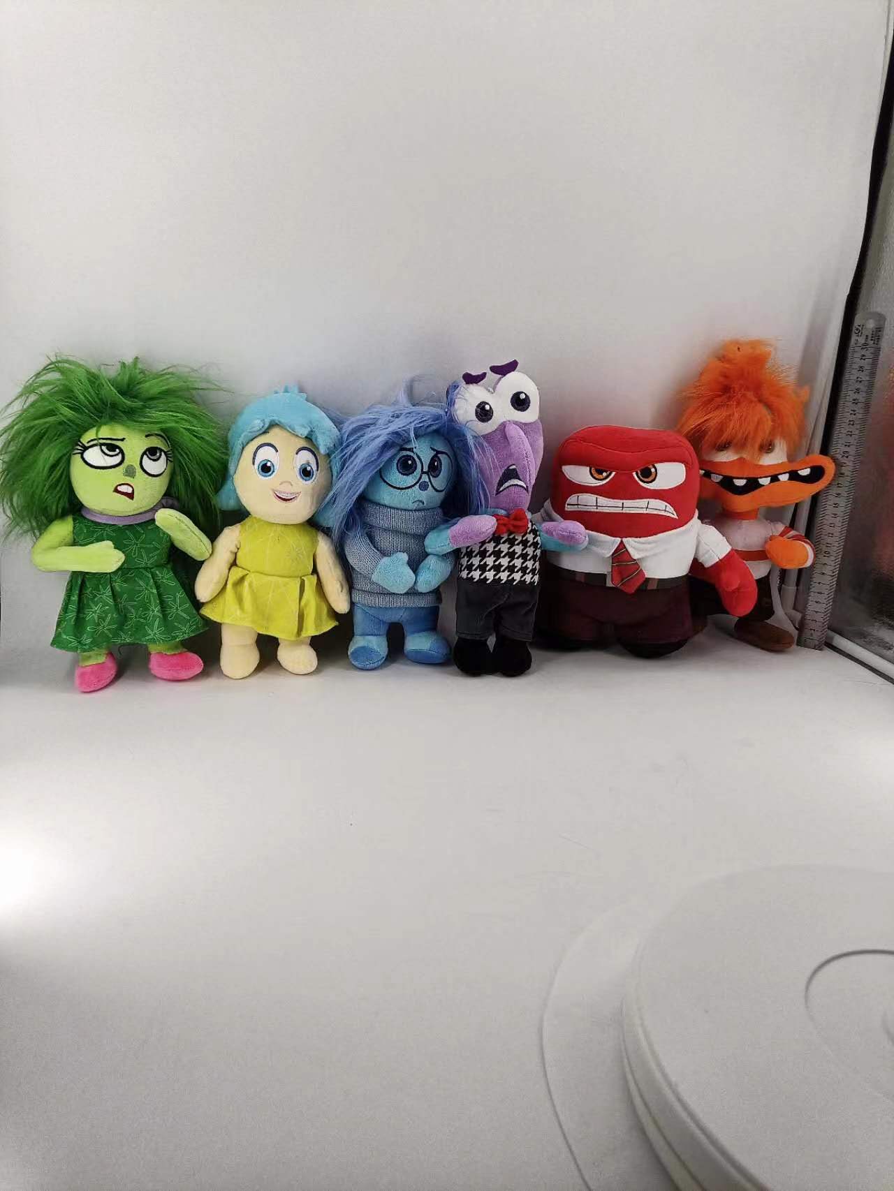 Inside Out 2 plush toy action figures surrounding the Inside Out movie thumbnail