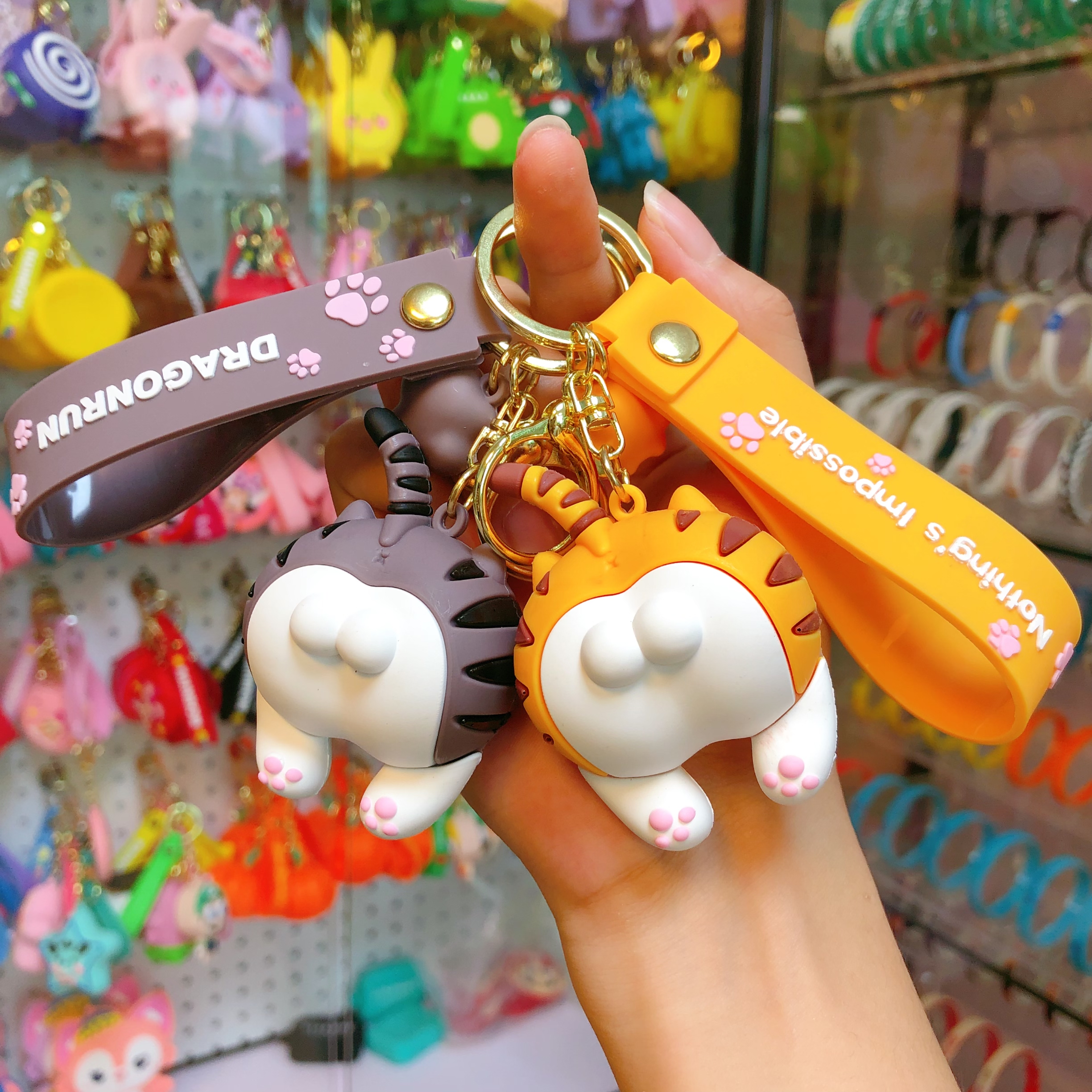 Cartoon cat fart keychain, cute girl's bag, soft plastic figurine pendant, personalized anime car key pendant