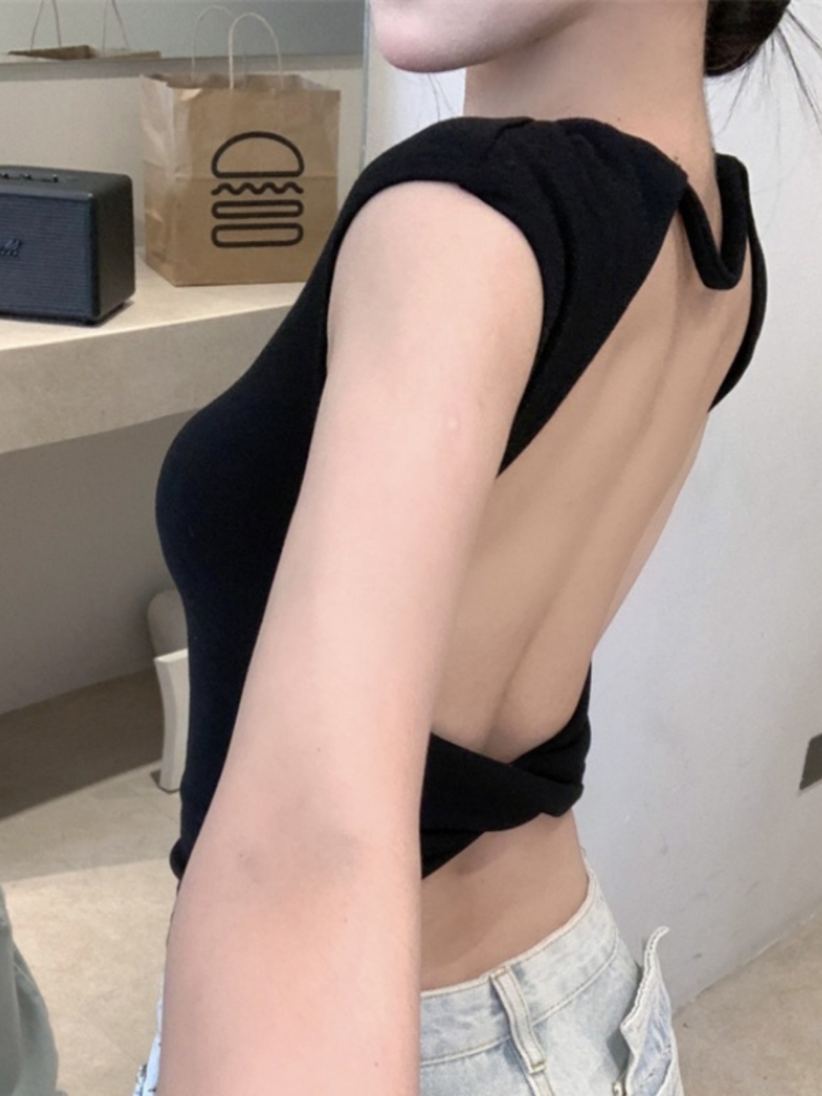 This summer design style features a cross-knotted front-shoulder short-sleeved T-shirt. It's a sexy, cut-out, backless top for women details Picture