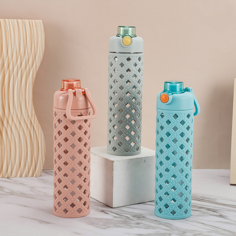 W67-9028 Double-layer hollowed-out water cup, novel office handle cup, bullet-lid straw double-drinking cup, best-selling water bottle Application Scenario