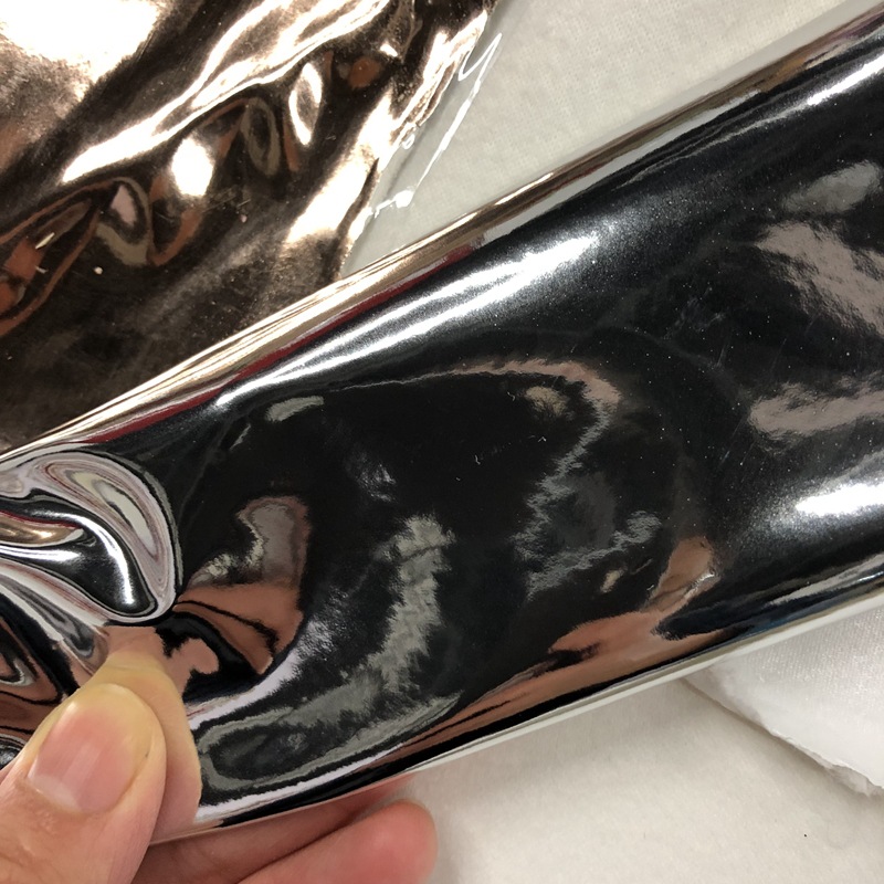 Metallic bright leather fabric color gold and silver bright film PU leather luminous bags and handbags festival decoration leather details Picture