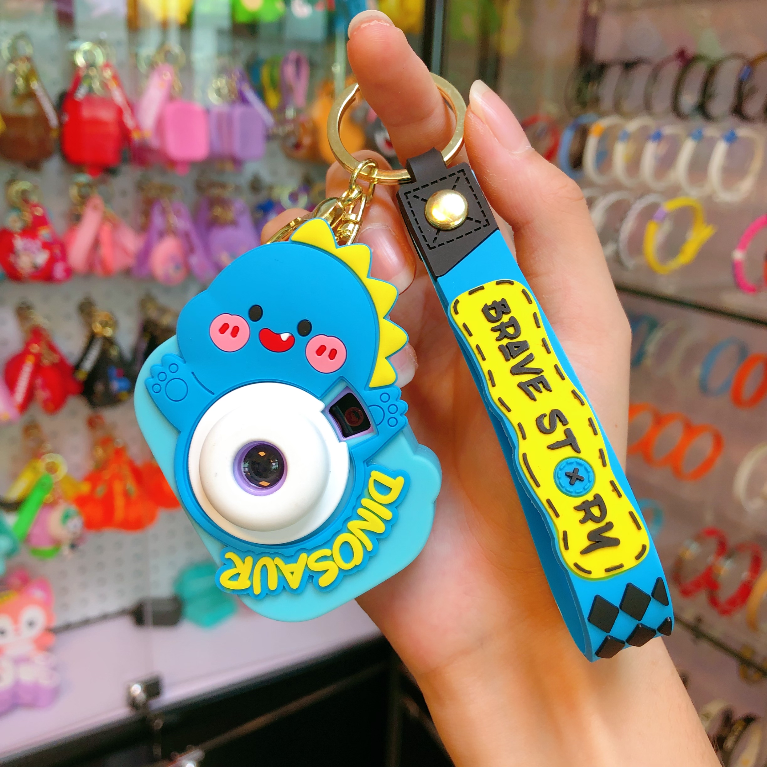 Wholesale of new car car pendants, illuminated key chains, keychains, and cute little figurines with dinosaur cameras Specification image