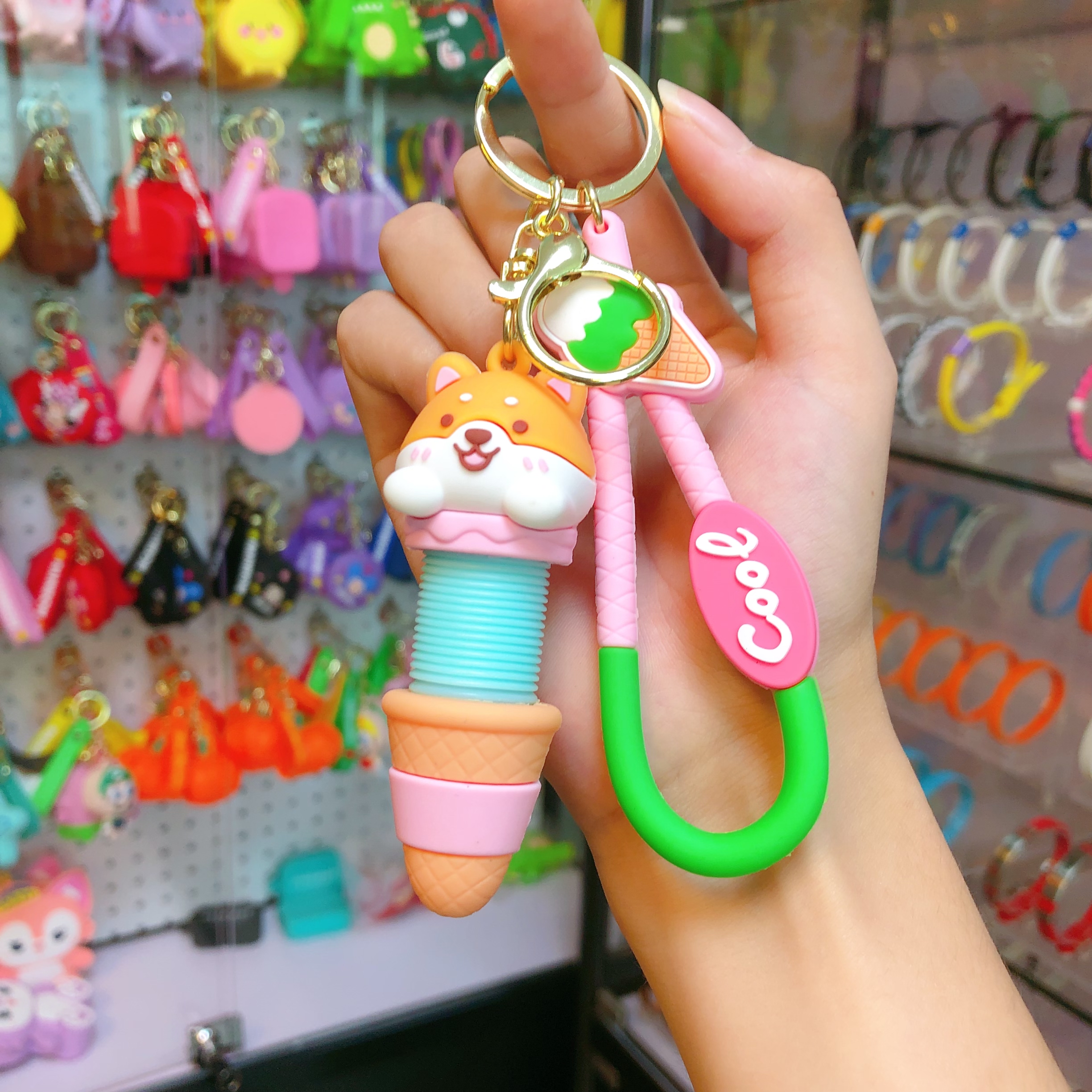 Wholesale of cartoon creative stretchable neck keychains, fun stress-relieving bag pendants, car ornaments, chain rings, and small gifts Specification image