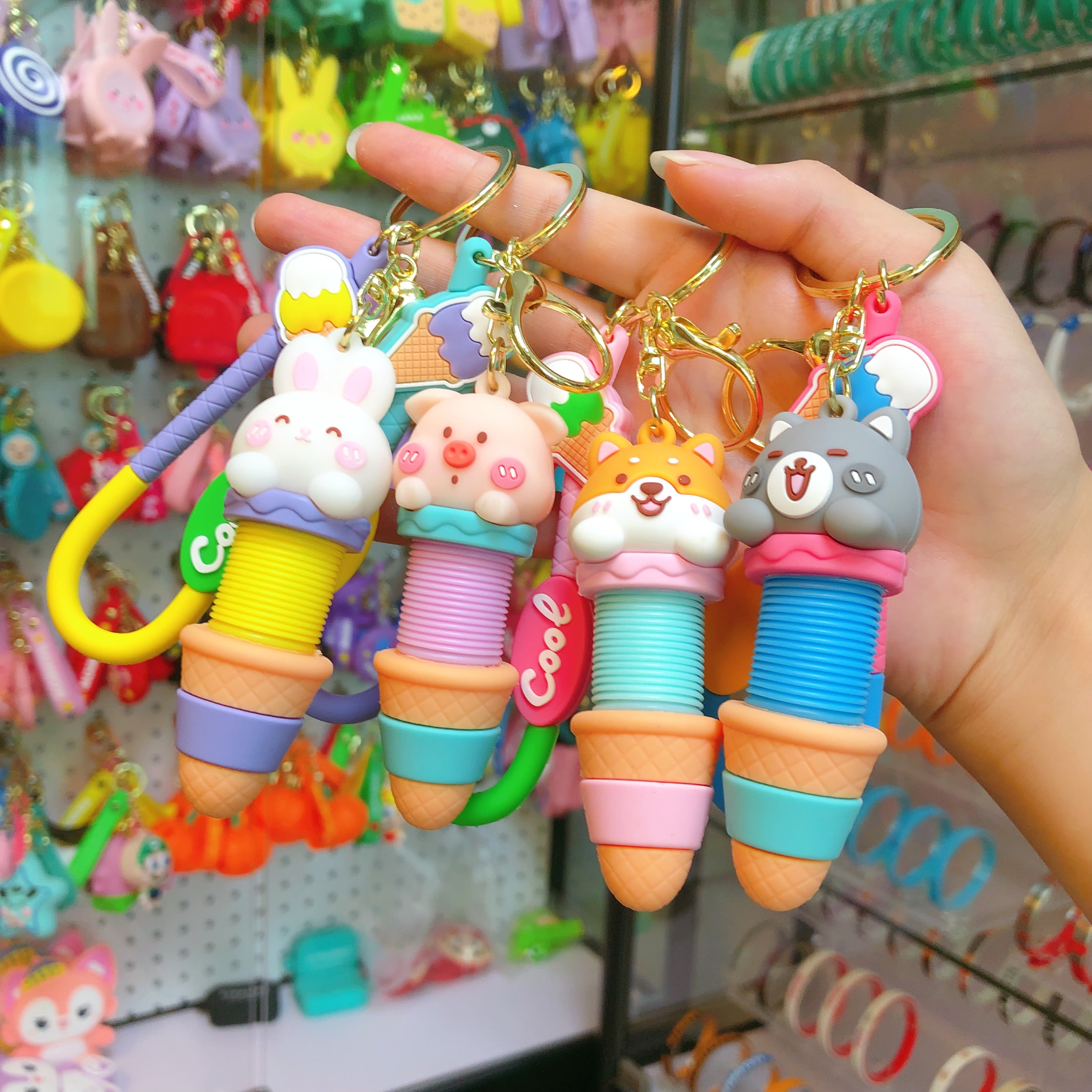 Wholesale of cartoon creative stretchable neck keychains, fun stress-relieving bag pendants, car ornaments, chain rings, and small gifts