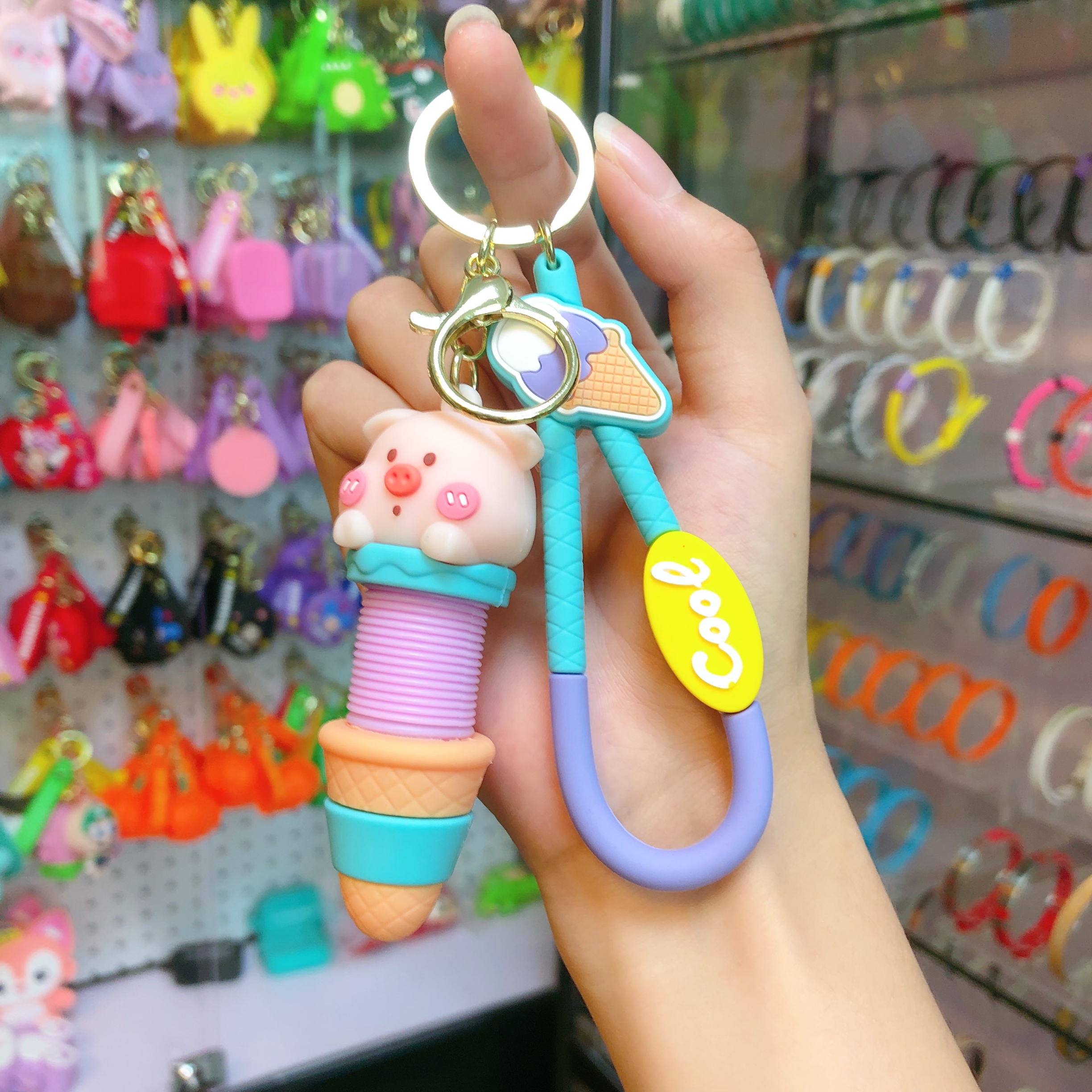 Wholesale of cartoon creative stretchable neck keychains, fun stress-relieving bag pendants, car ornaments, chain rings, and small gifts details Picture