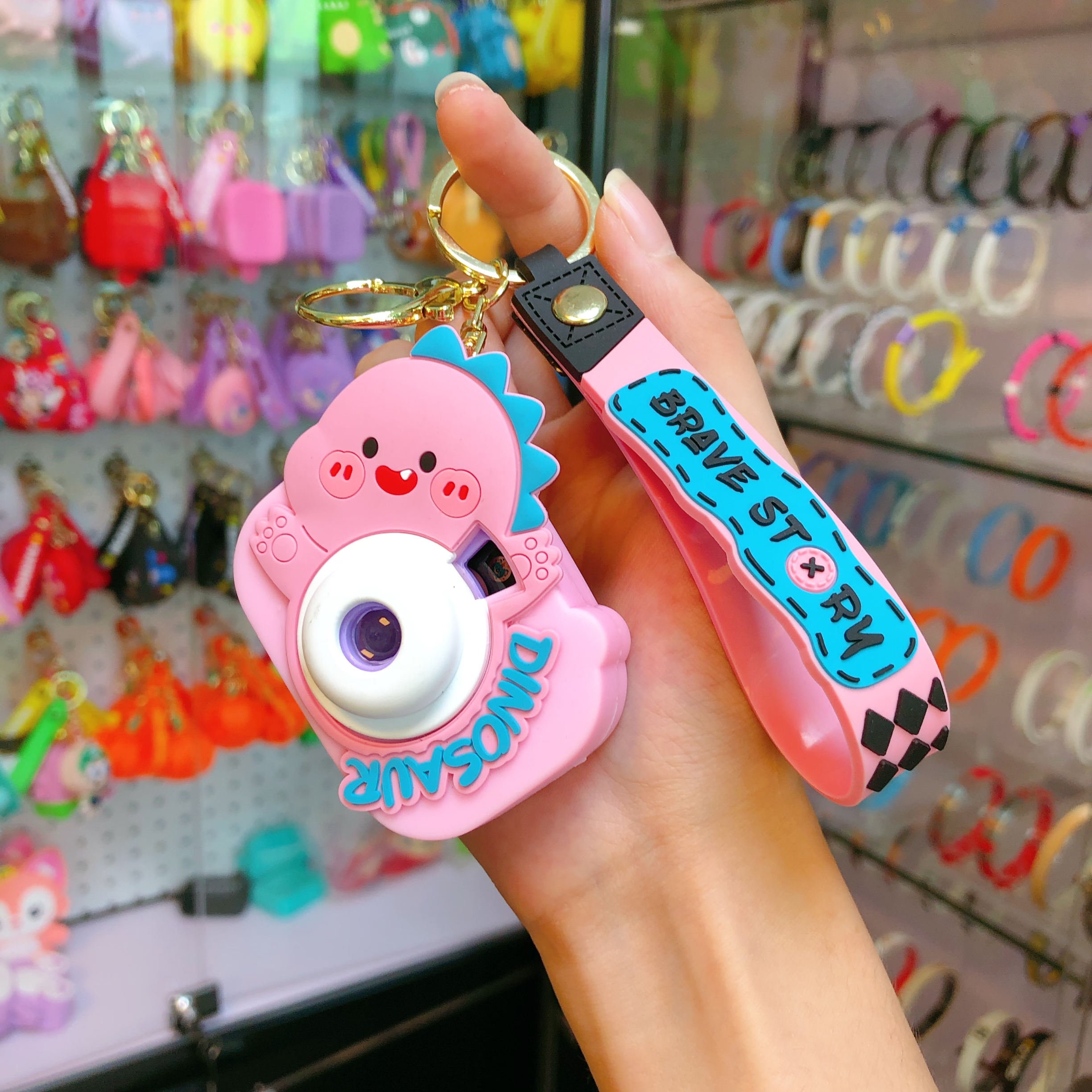 Wholesale of new car car pendants, illuminated key chains, keychains, and cute little figurines with dinosaur cameras Application Scenario