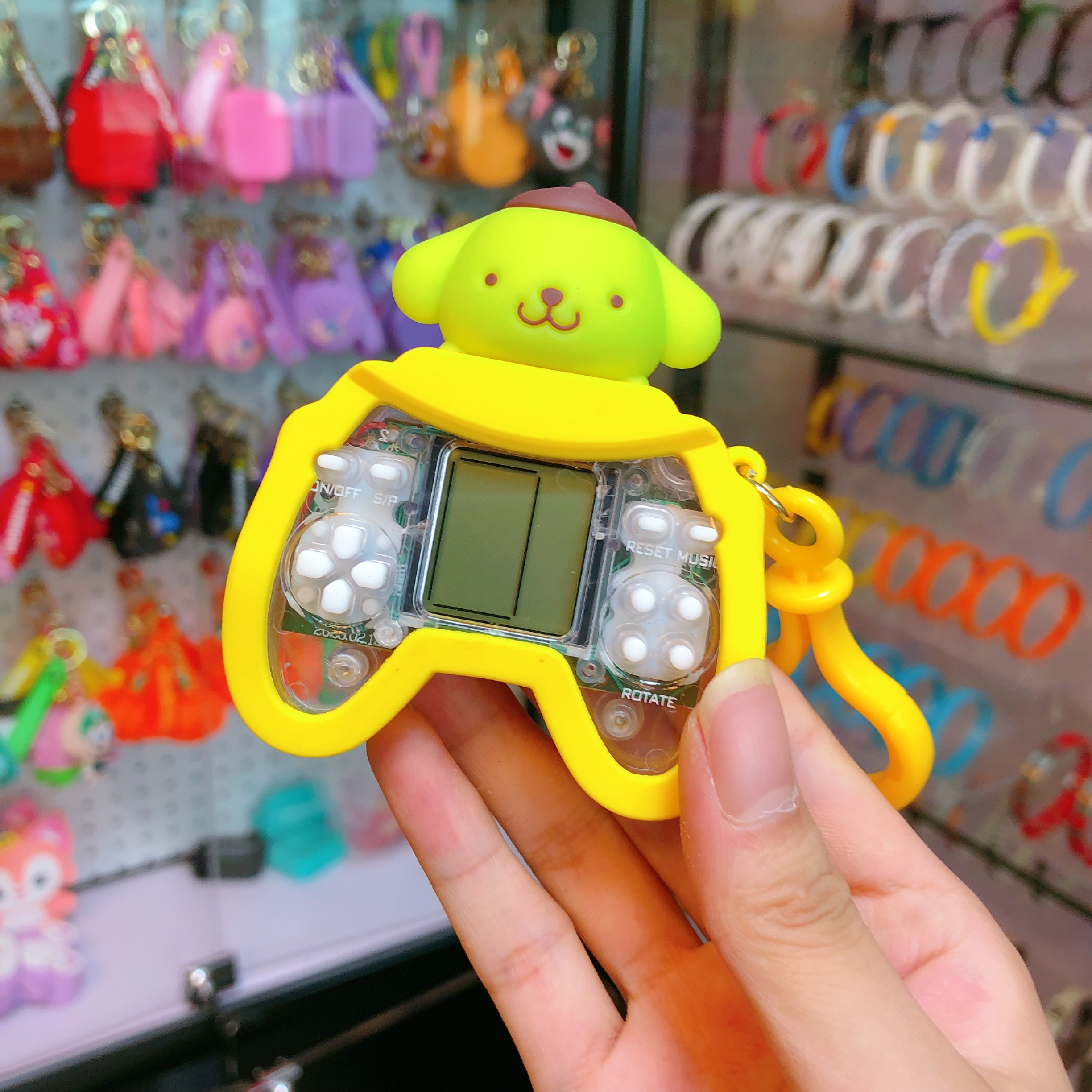Dibujos animados cute gui perro manija máquina de juego llavero colgante puzzle juguete pequeño regalo muñeca máquina pequeño regalo pequeño juguete juguete pequeño regalo pequeño regalo Specification image