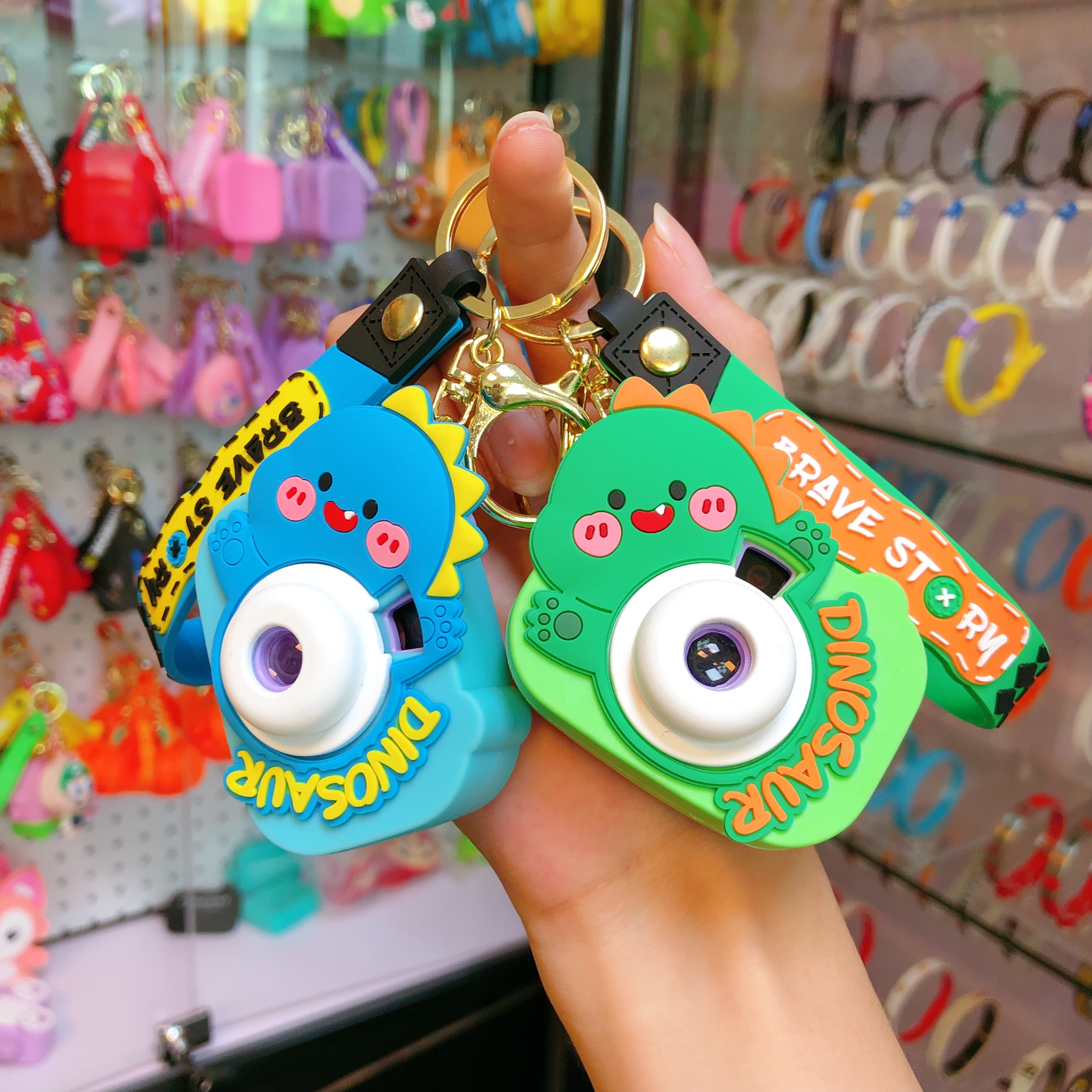 Wholesale of new car car pendants, illuminated key chains, keychains, and cute little figurines with dinosaur cameras details Picture