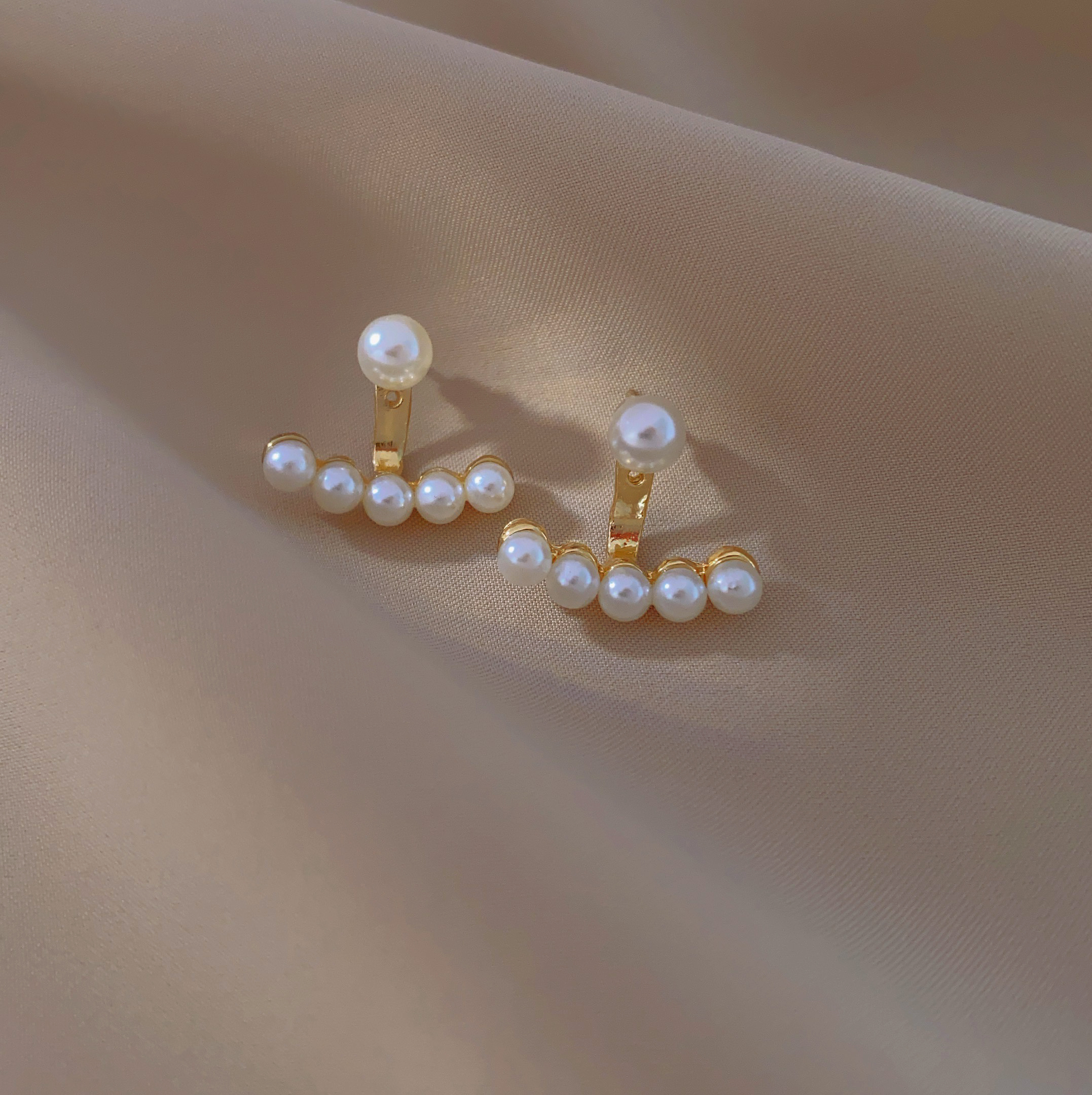 A new and fashionable pair of earrings with two earrings, exuding a sense of elegance and sophistication. These earrings feature a niche design for women details Picture