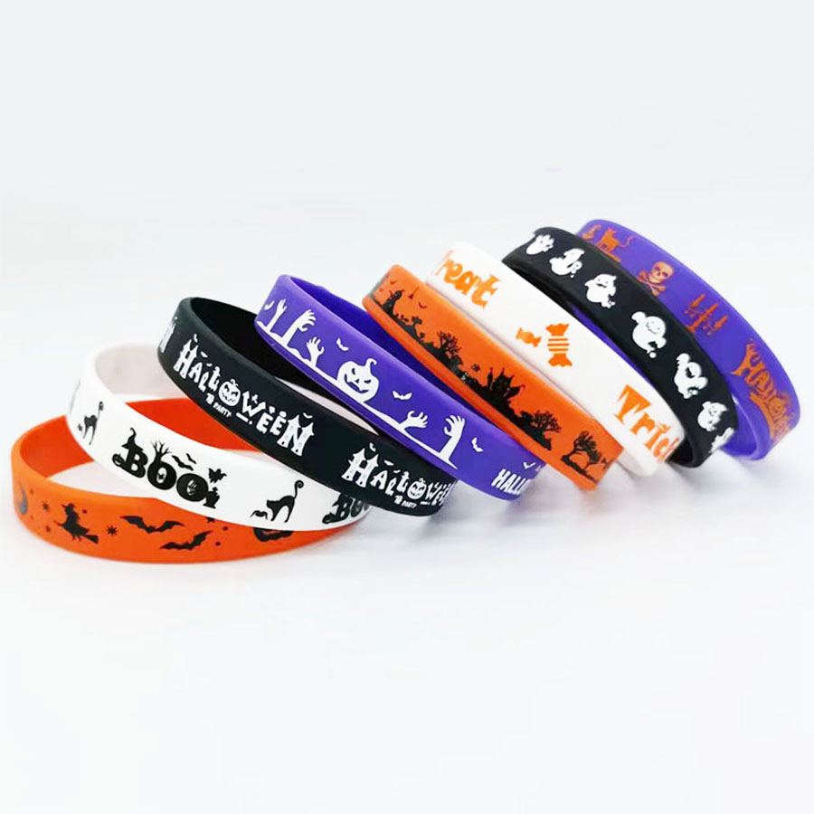 Halloween party Halloween Silicone wristband with pumpkin on the wrist. Trick or Treat! Wristband Halloween party Halloween Silicone Wristband hand Specification image